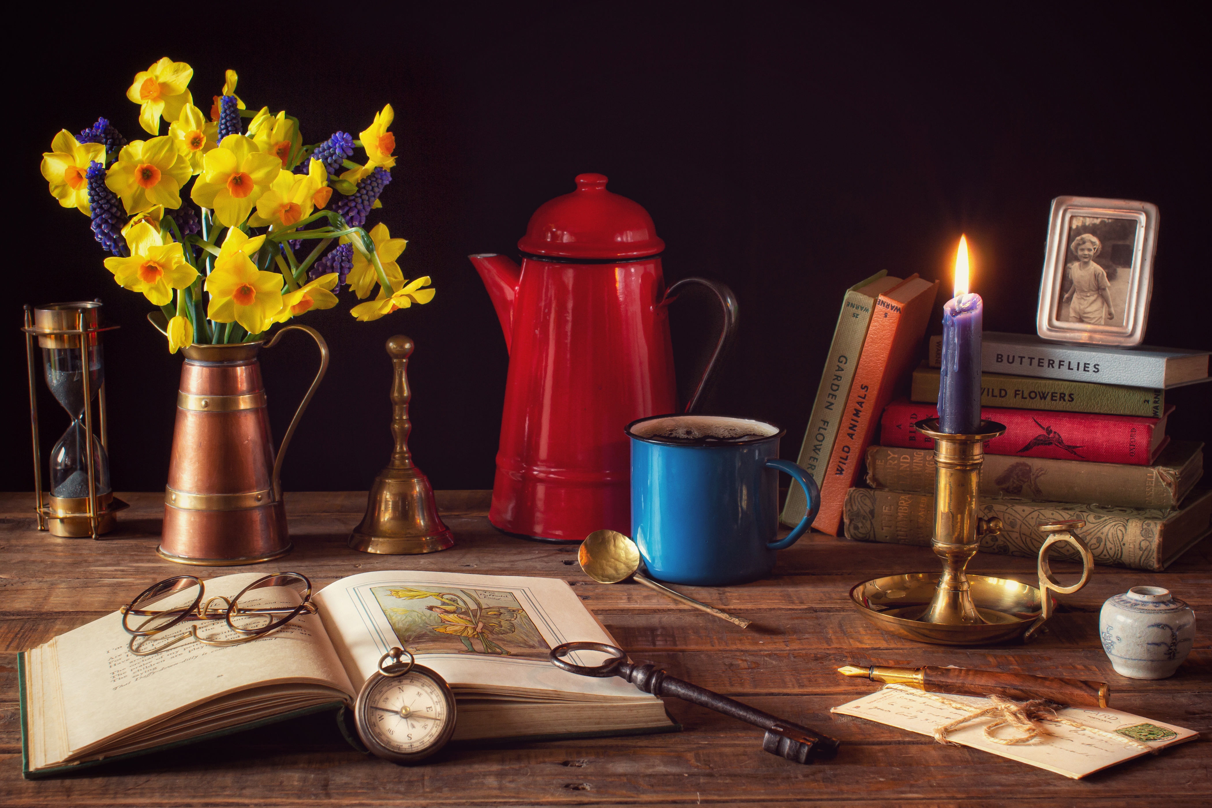 photography, still life, book, candle, compass, daffodil, glasses, key, pitcher