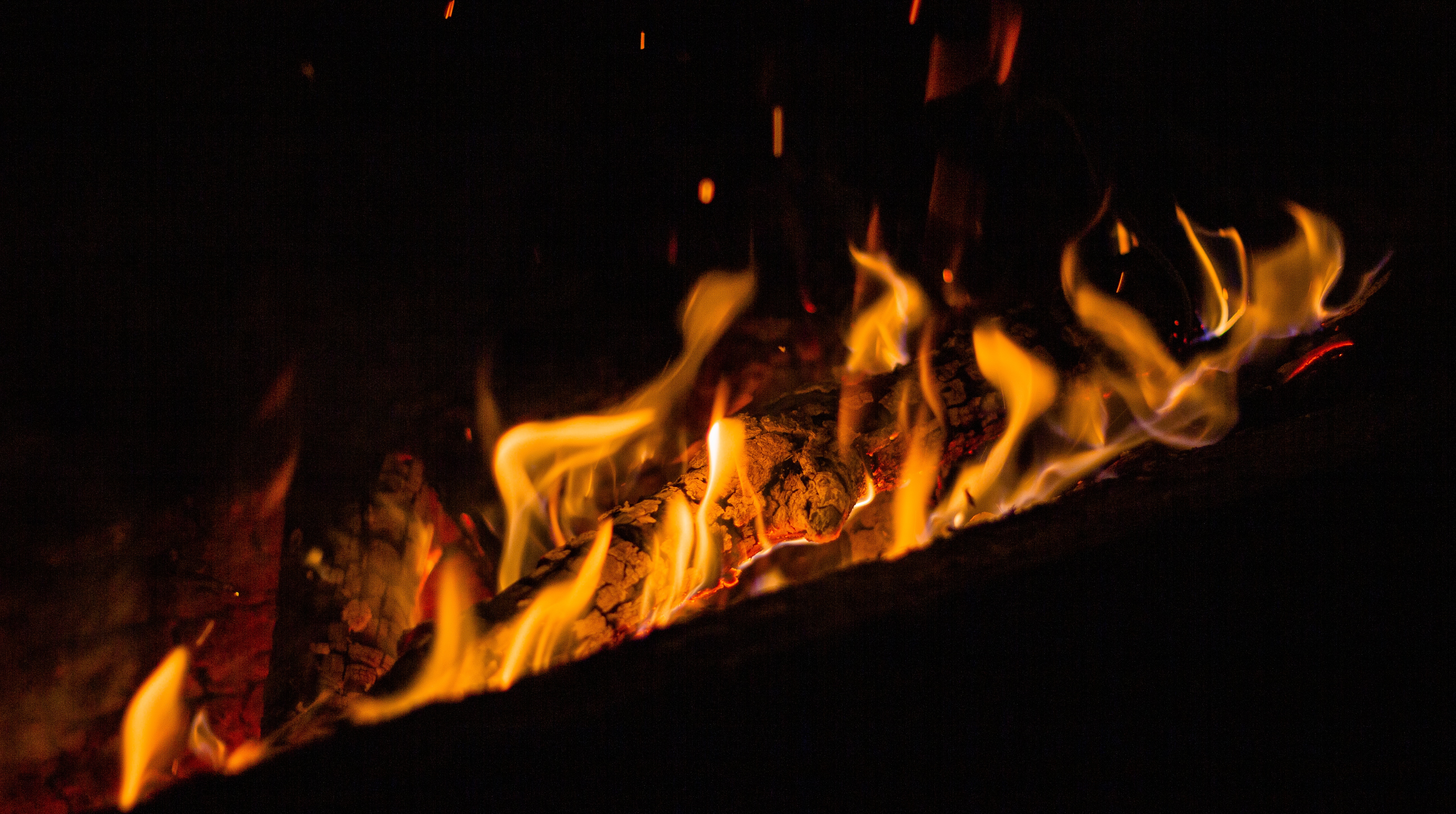 Download mobile wallpaper Sparks, Flame, Bonfire, Fire, Dark for free.