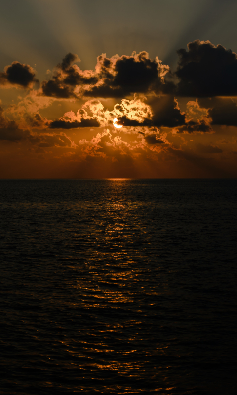 Download mobile wallpaper Sunset, Sun, Horizon, Ocean, Earth, Cloud, Sunbeam, Sunbean for free.