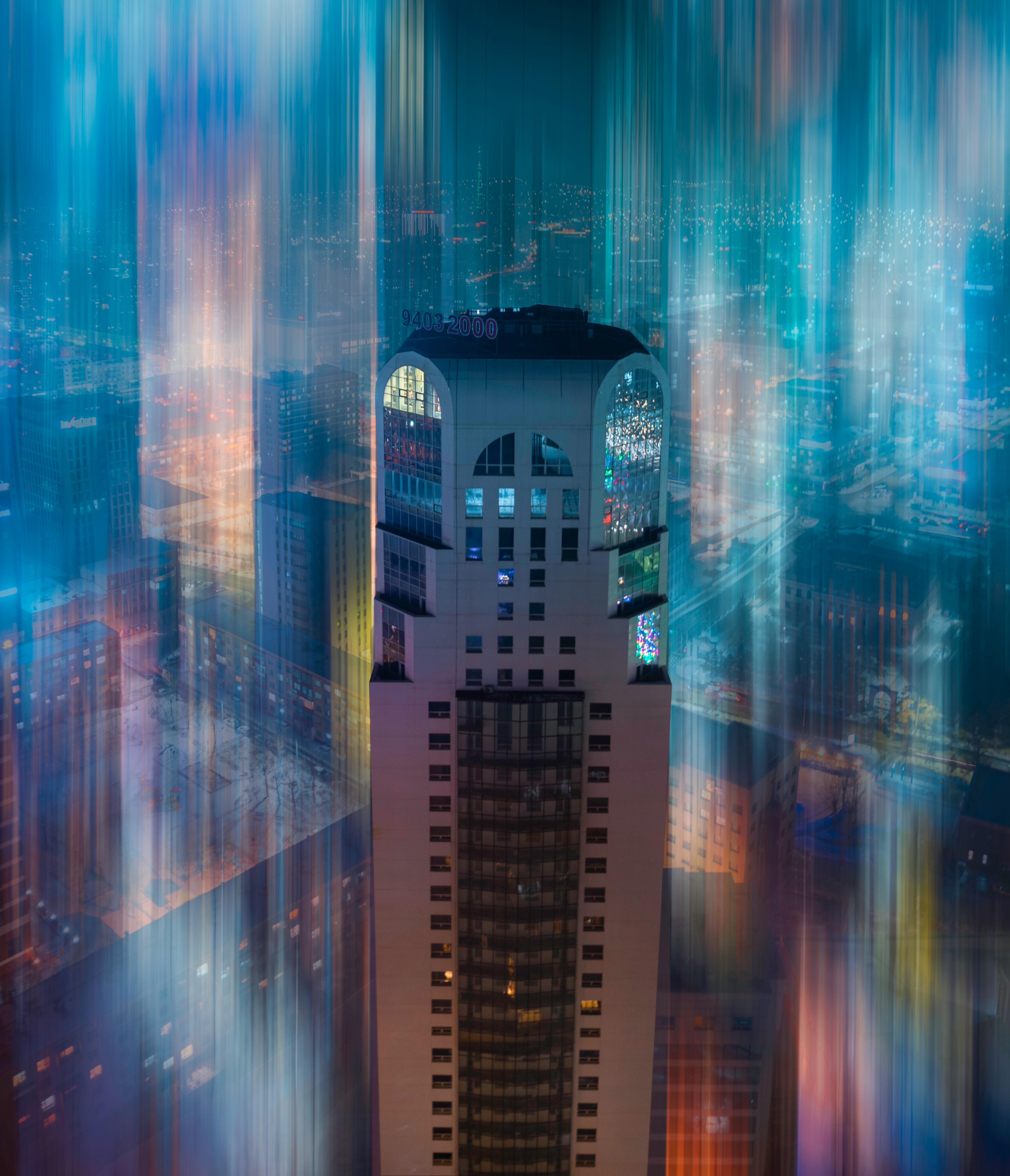 Download mobile wallpaper Building, Miscellanea, Miscellaneous, Tower, Smooth, Light, Shine, Architecture, Blur for free.