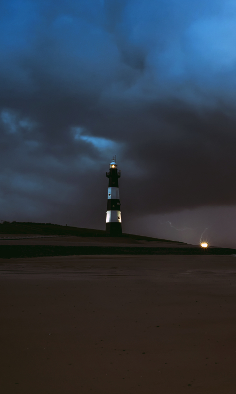 Download mobile wallpaper Night, Beach, Sand, Horizon, Lighthouse, Man Made for free.