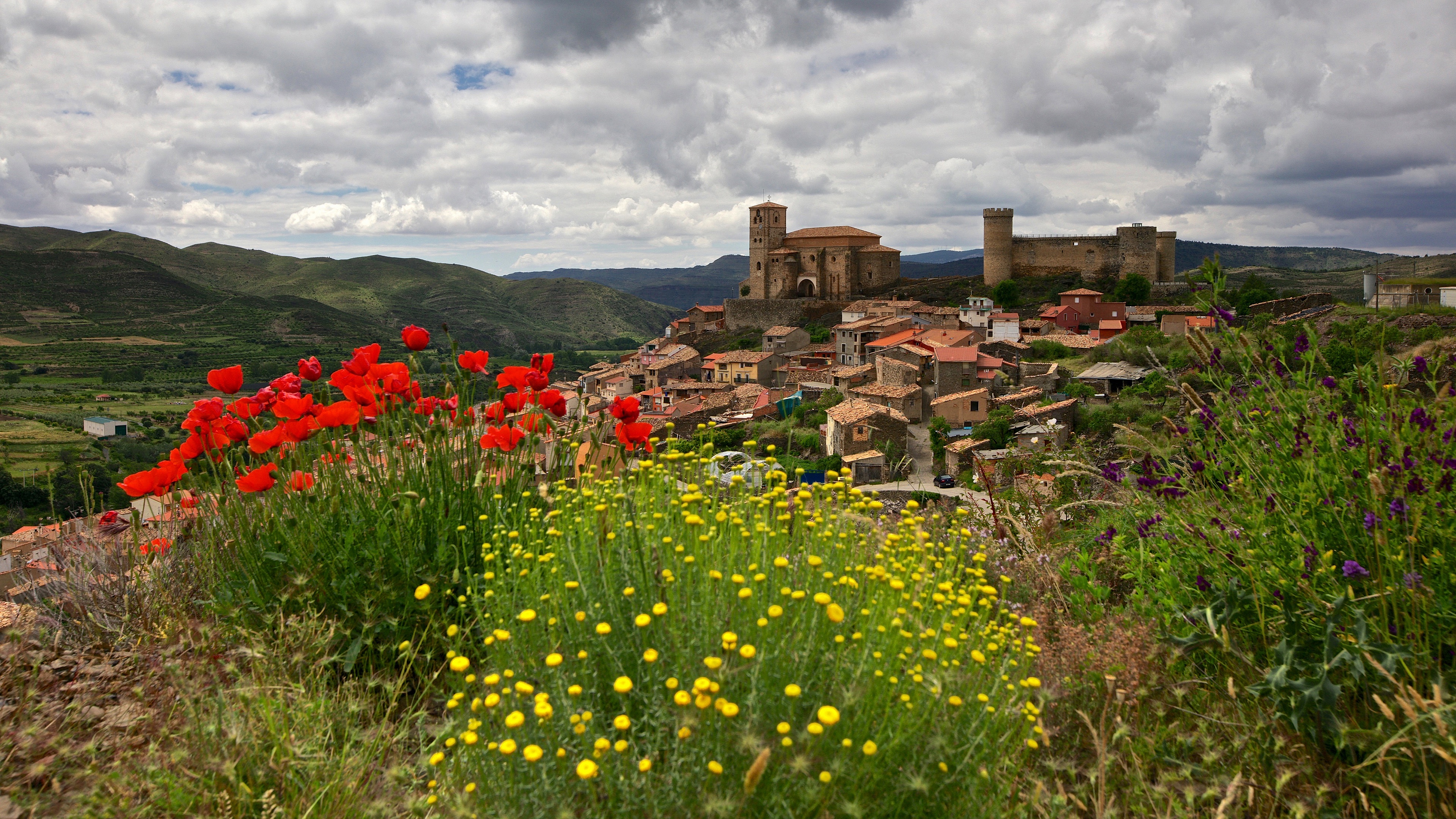 Download mobile wallpaper Flower, Village, Spain, Poppy, Man Made, Castle for free.