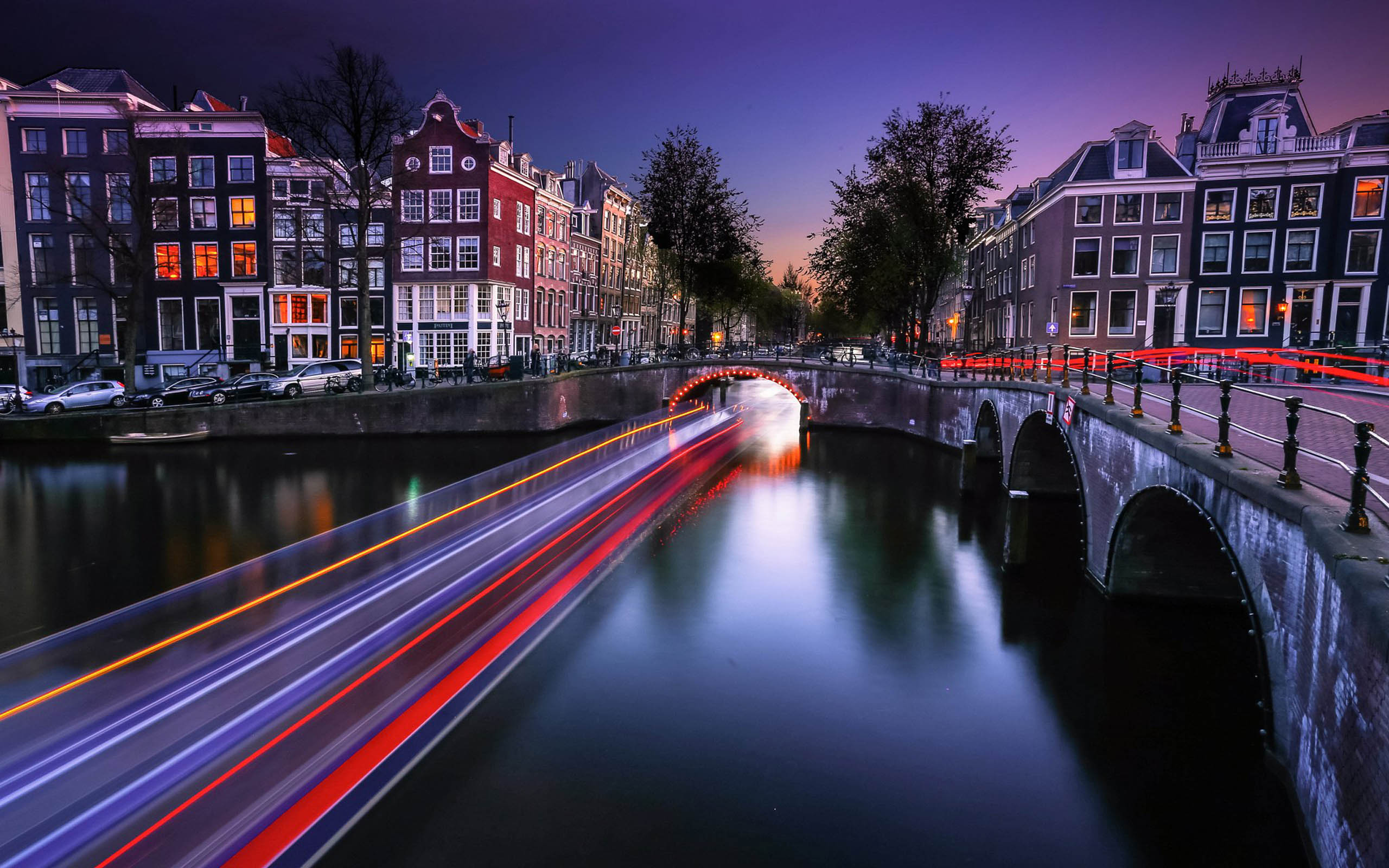 Download mobile wallpaper Cities, Night, City, Light, Bridge, Cityscape, Netherlands, Amsterdam, Man Made, Time Lapse for free.