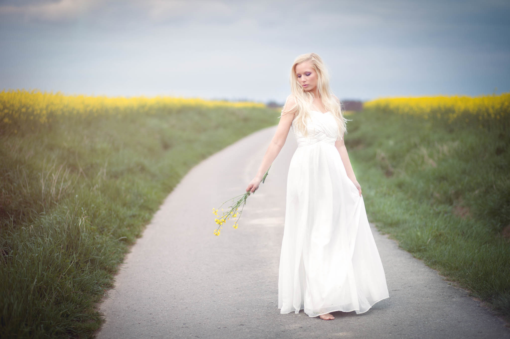 Download mobile wallpaper Flower, Road, Field, Mood, Bokeh, Blonde, Model, Women, Yellow Flower, White Dress, Outdoor for free.