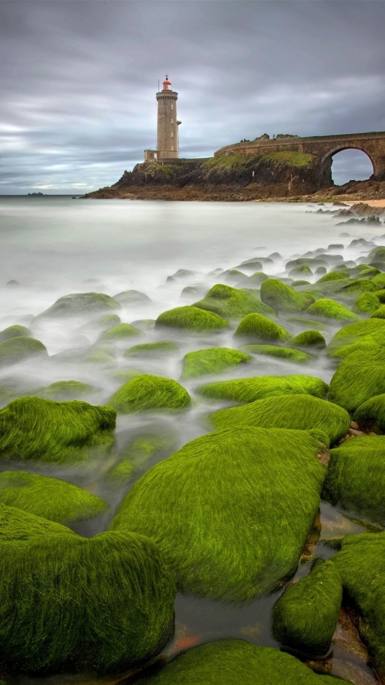 Download mobile wallpaper Stone, Lighthouse, Moss, Cloud, Man Made, Seashore for free.