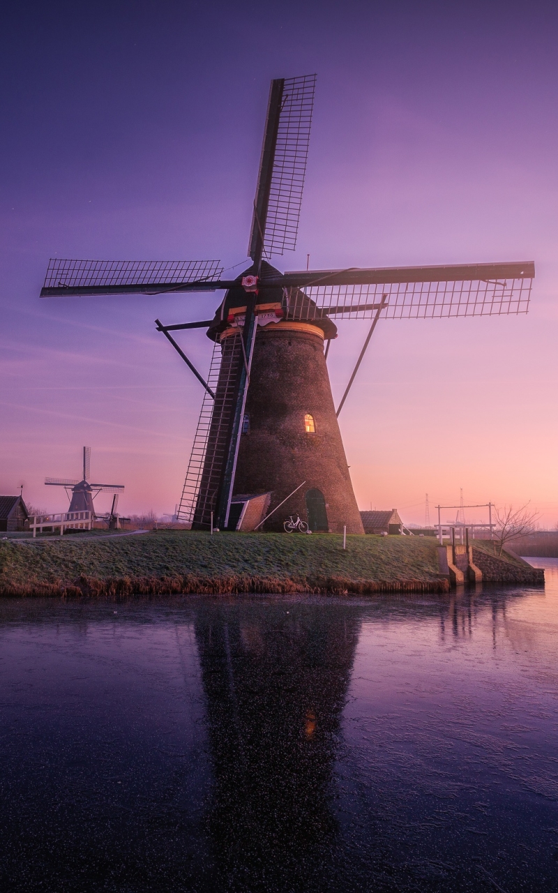 Download mobile wallpaper Sky, Building, Reflection, Sunrise, Windmill, Man Made for free.