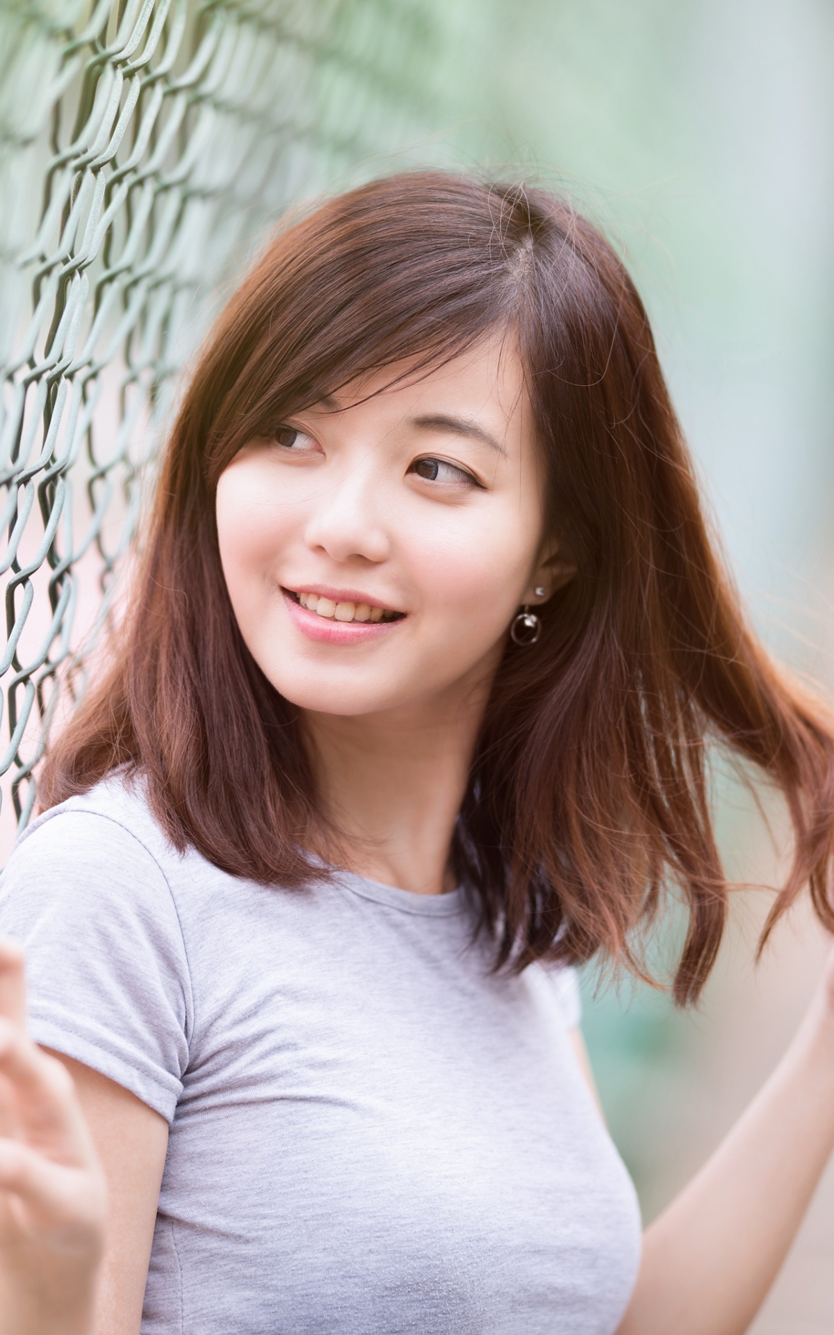 Download mobile wallpaper Blur, Fence, Smile, Brunette, Model, Women, Asian for free.