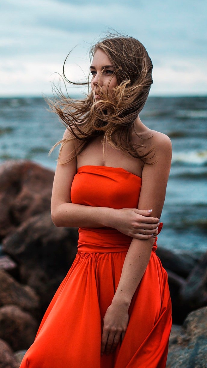 Download mobile wallpaper Ocean, Brunette, Model, Women, Depth Of Field, Orange Dress for free.