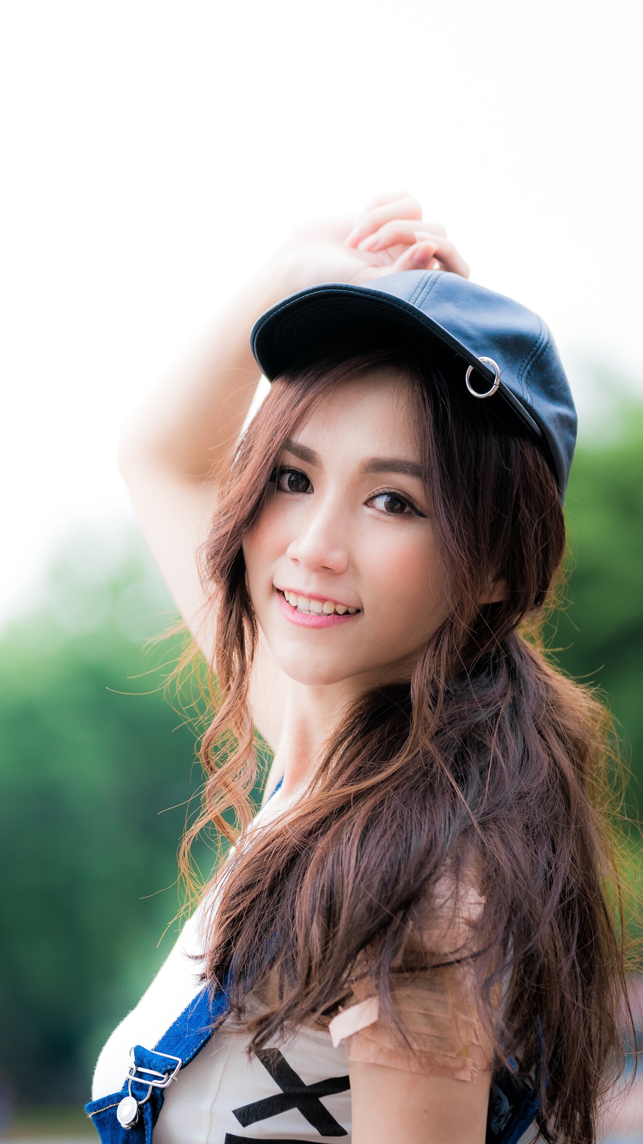 Download mobile wallpaper Smile, Cap, Brunette, Model, Women, Asian for free.