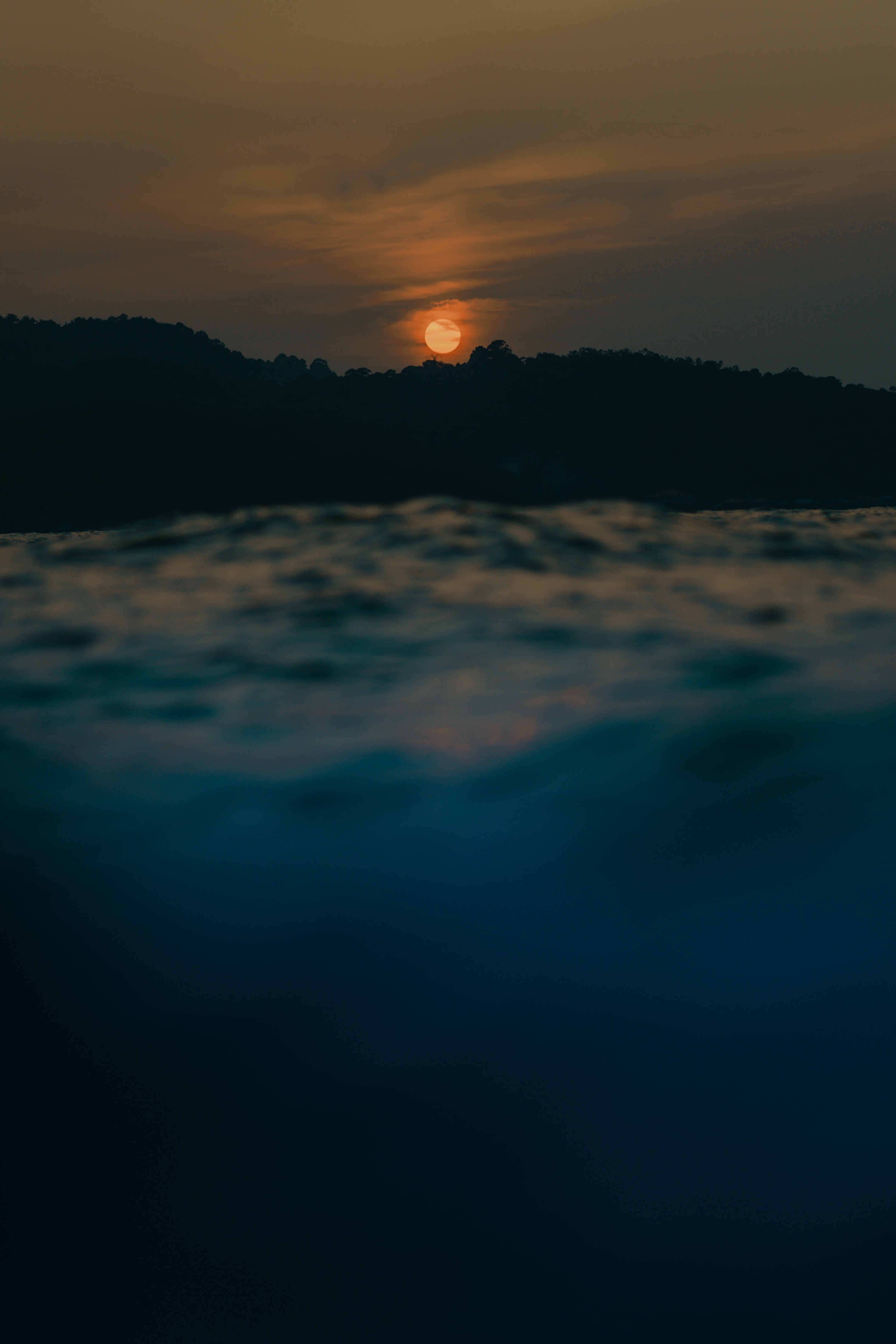 Download mobile wallpaper Smooth, Trees, Nature, Sun, Blur, Sunset, Sea for free.
