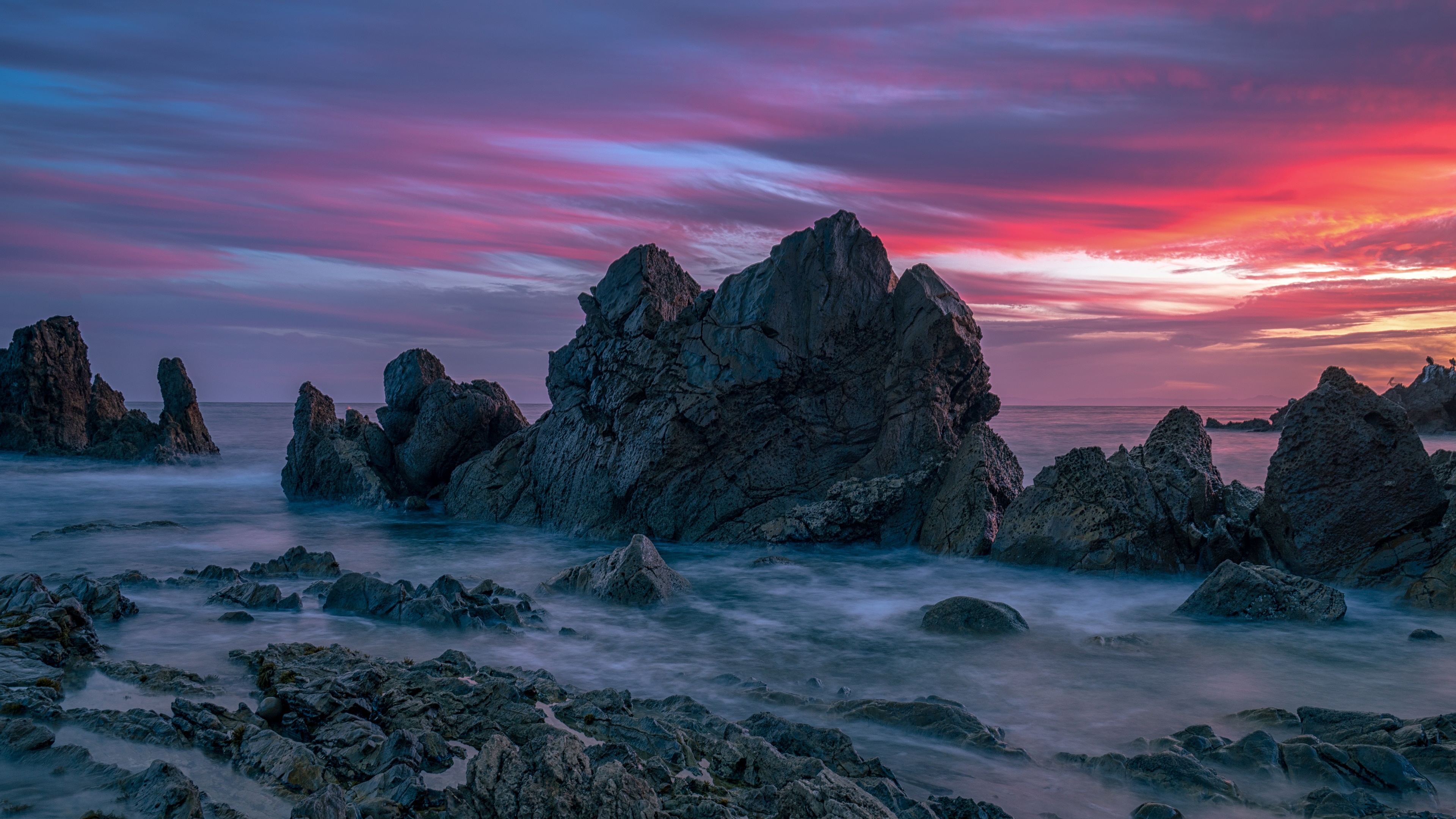 Download mobile wallpaper Sunset, Sky, Rock, Ocean, Earth for free.