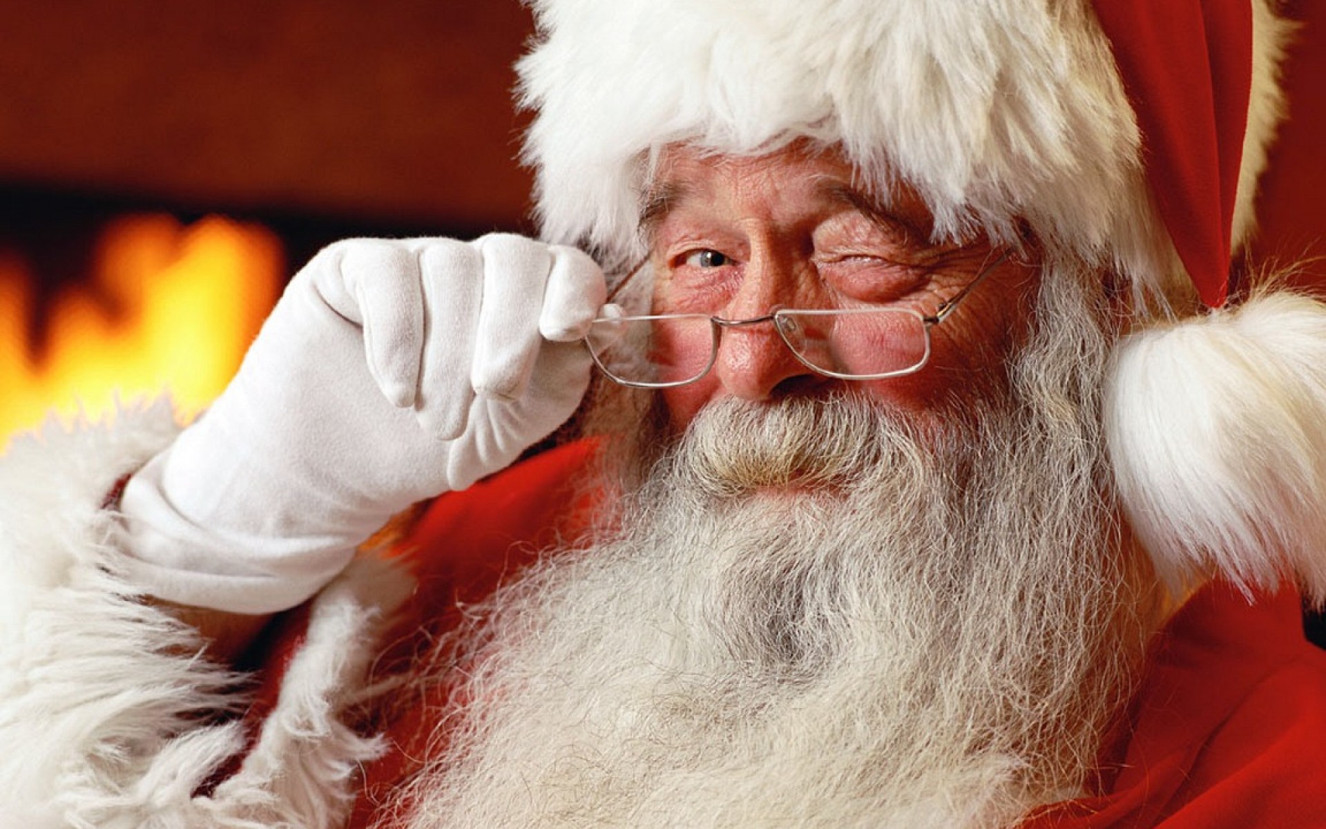 Скачать картинку Рождество, Подмигивание, Праздничные, Санта в телефон бесплатно.