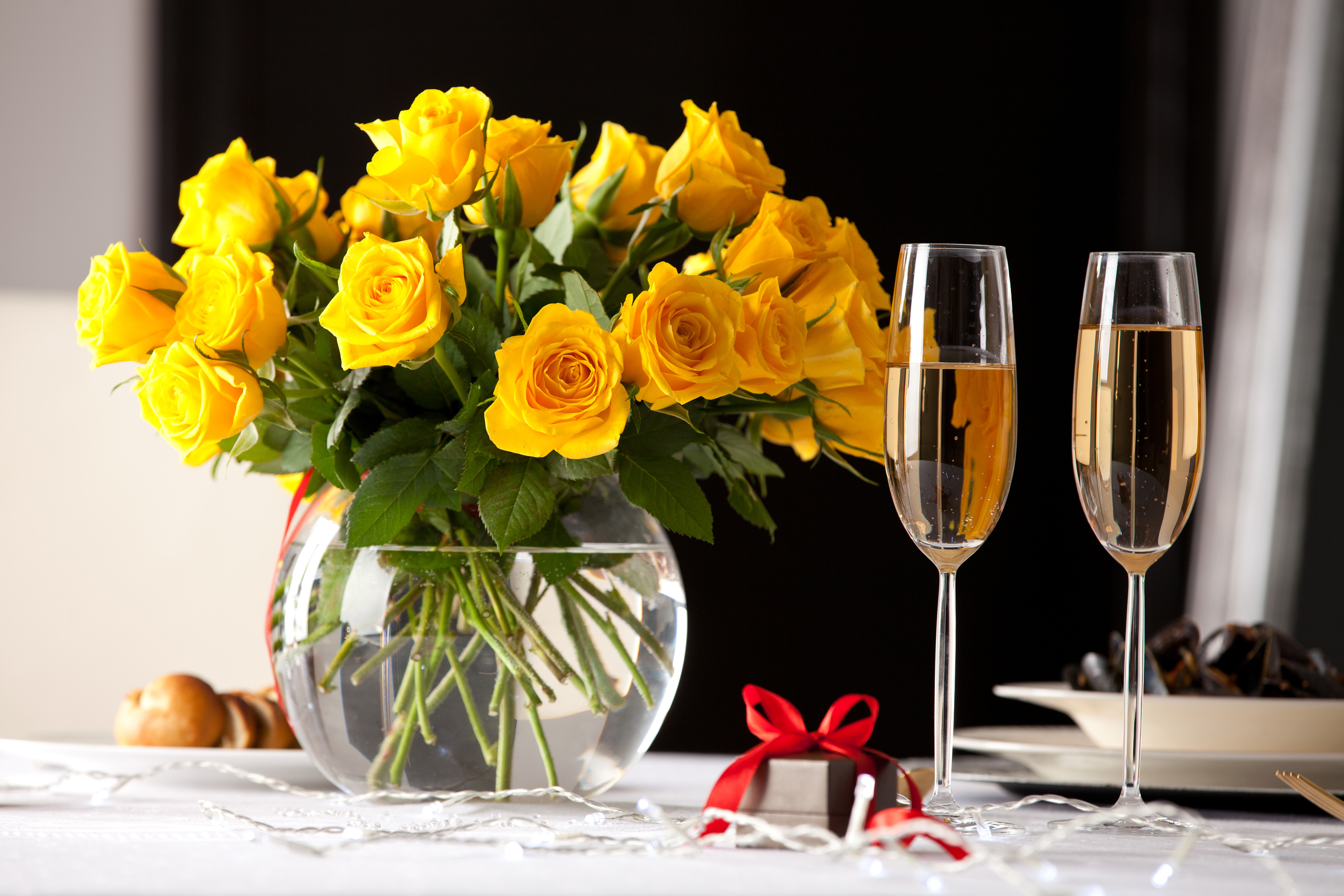 Download mobile wallpaper Still Life, Flower, Glass, Gift, Vase, Photography, Champagne, Yellow Rose for free.