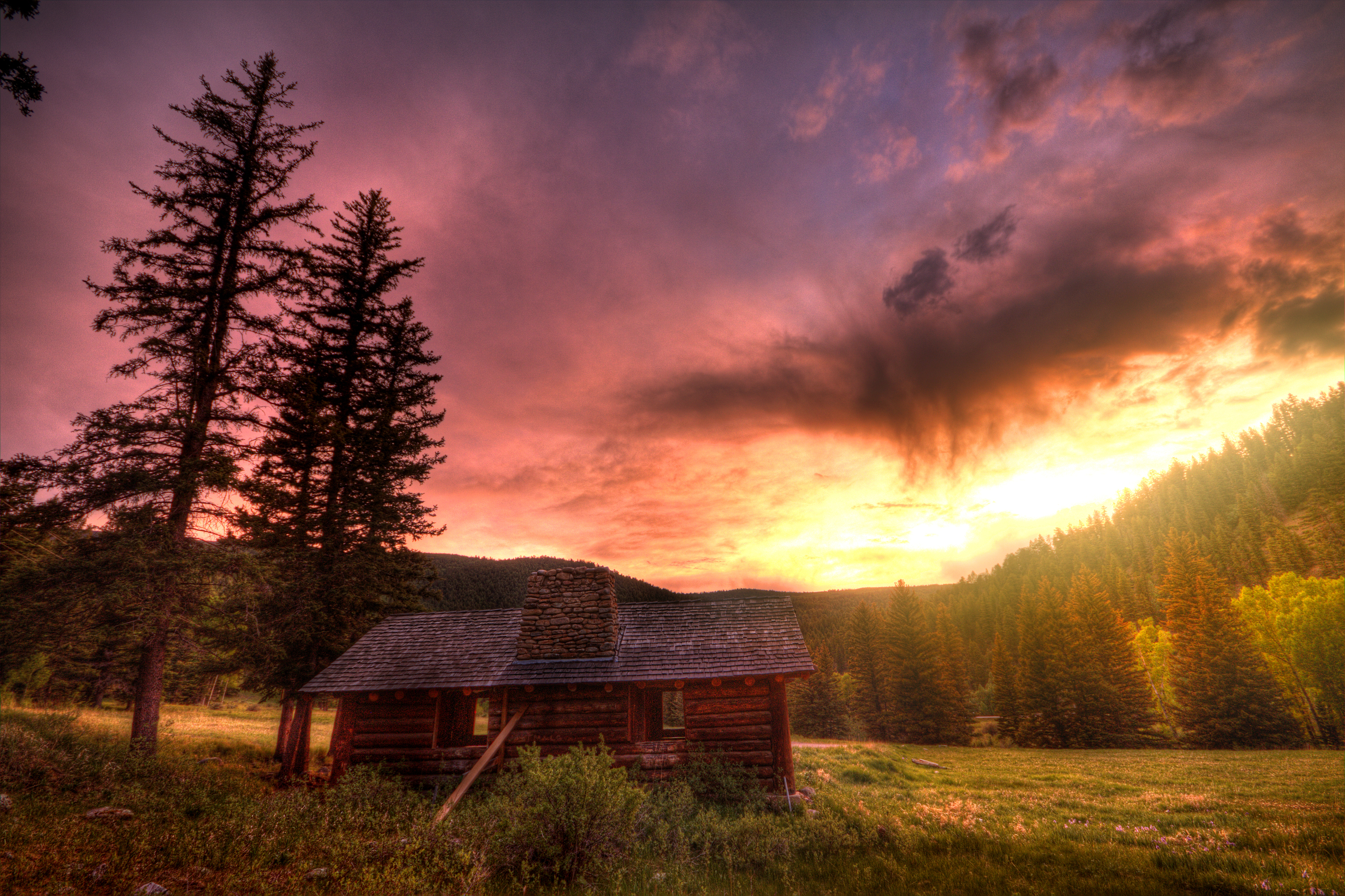 Download mobile wallpaper Landscape, Sunset, Mountain, Forest, Tree, Cabin, Man Made for free.
