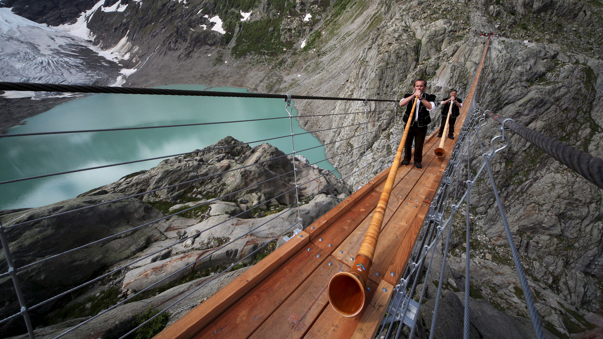 Download mobile wallpaper Men, Switzerland, Photography, Trift Bridge for free.