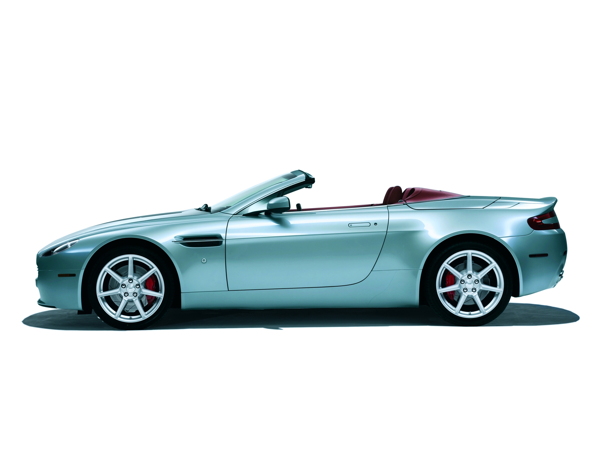 Скачать картинку Vantage, V8, 2006, Кабриолет, Зеленый, Астон Мартин (Aston Martin), Вид Сбоку, Тачки (Cars), Машины в телефон бесплатно.