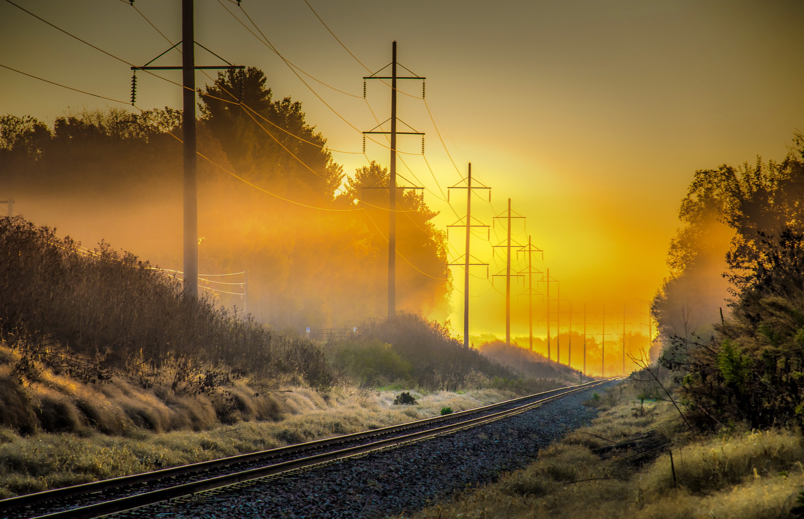 Download mobile wallpaper Fog, Sunrise, Railroad, Man Made, Power Line for free.