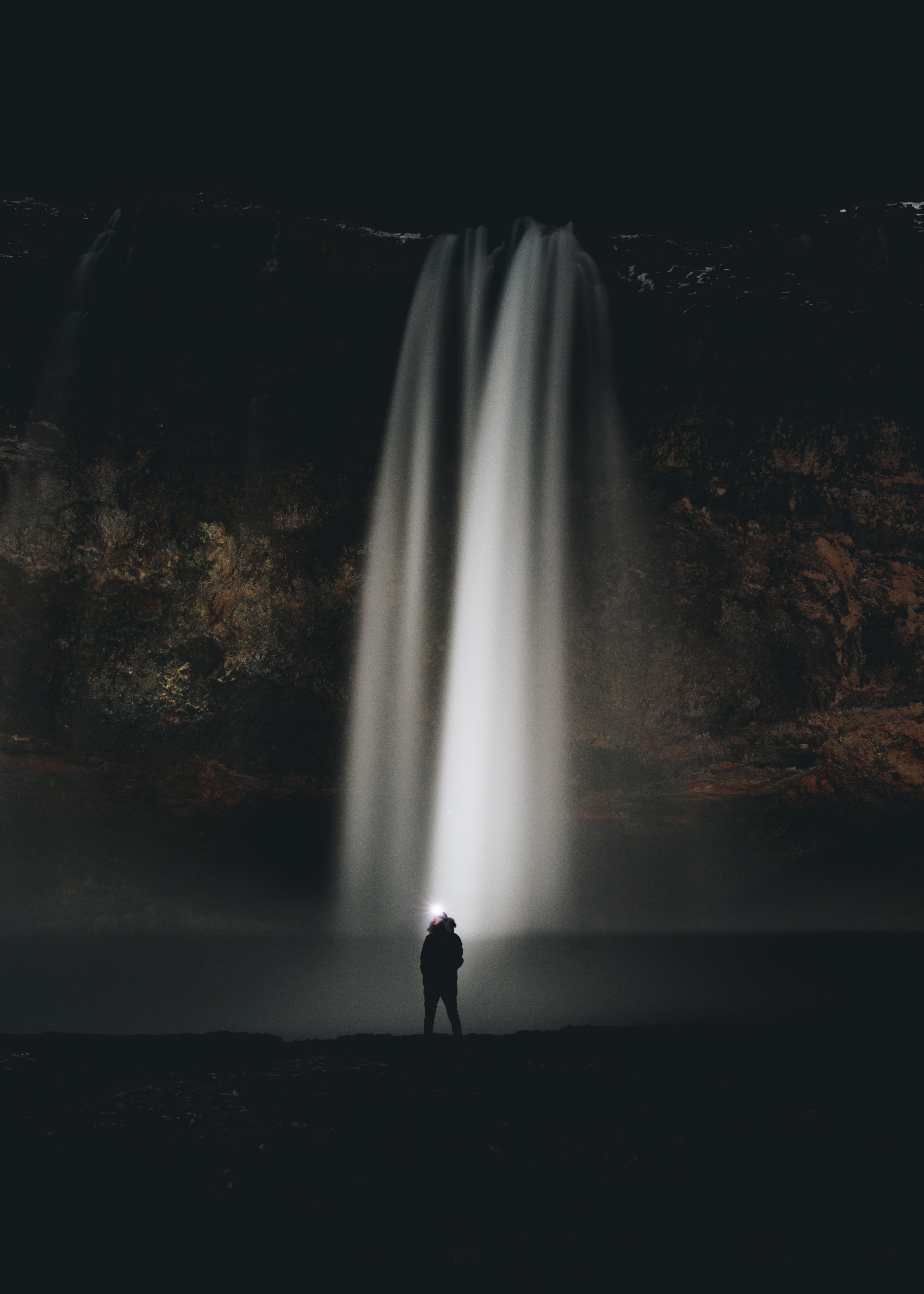 Download mobile wallpaper Stream, Waterfall, Flow, Person, Human, Night, Dark for free.