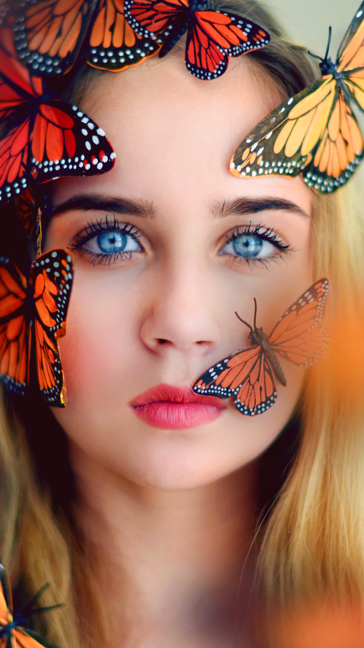 Download mobile wallpaper Blur, Butterfly, Blonde, Face, Model, Women, Blue Eyes for free.