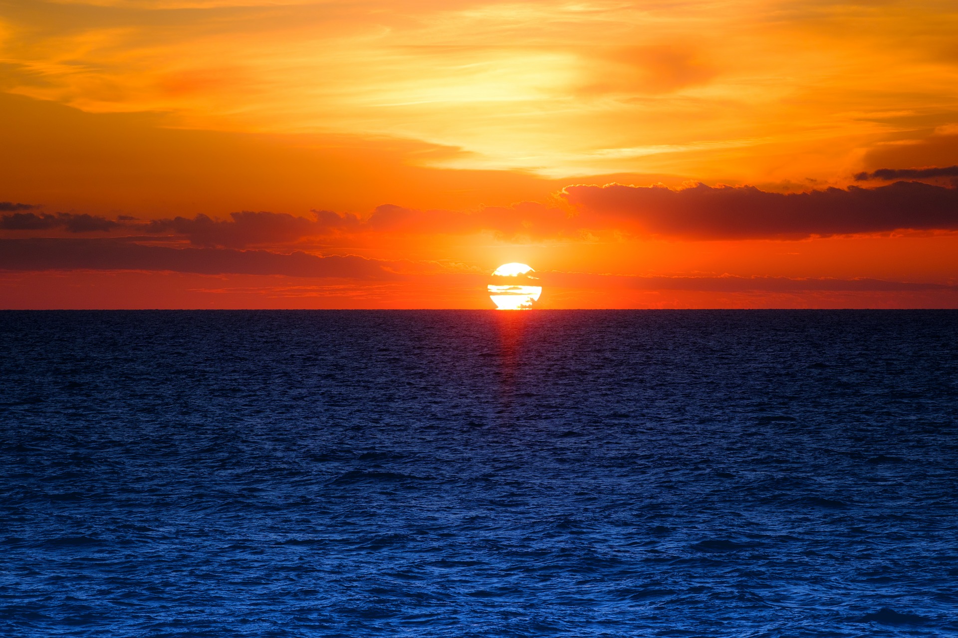 Download mobile wallpaper Sunset, Sky, Sea, Sun, Ocean, Earth for free.