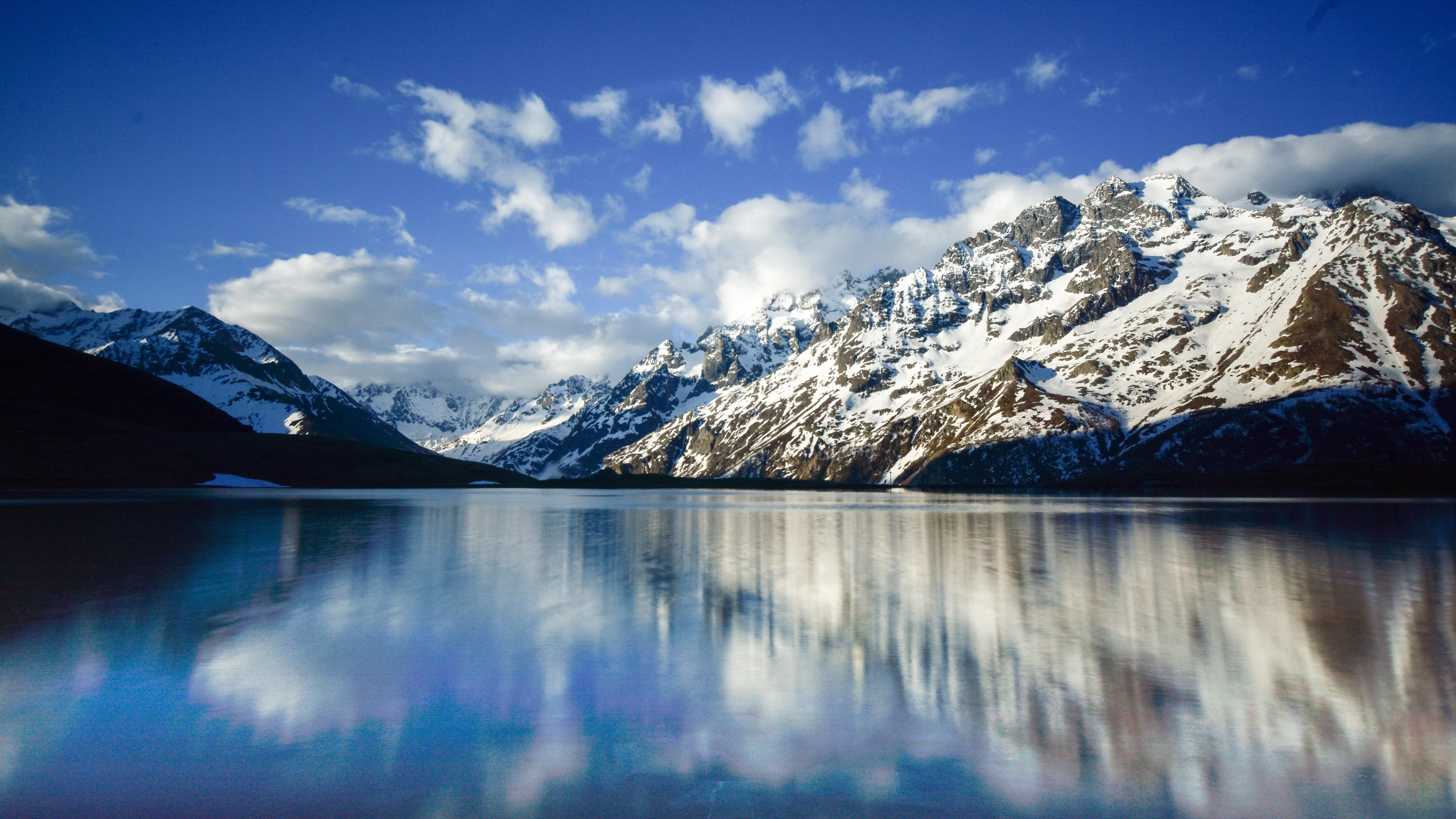 Download mobile wallpaper Winter, Snow, Lakes, Mountain, Lake, Reflection, Earth, Cloud for free.