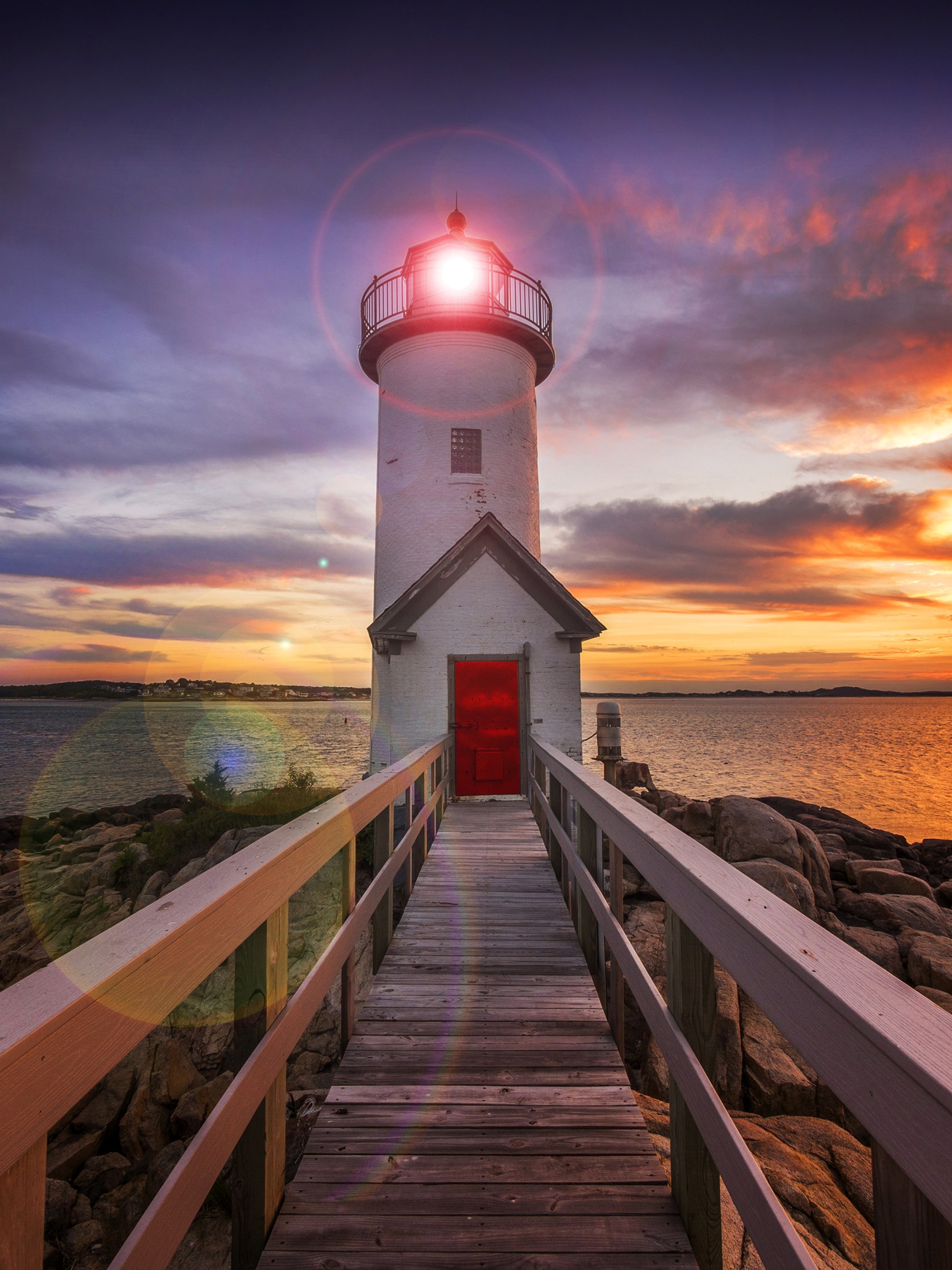 Download mobile wallpaper Sunset, Sky, Wood, Lighthouse, Man Made for free.