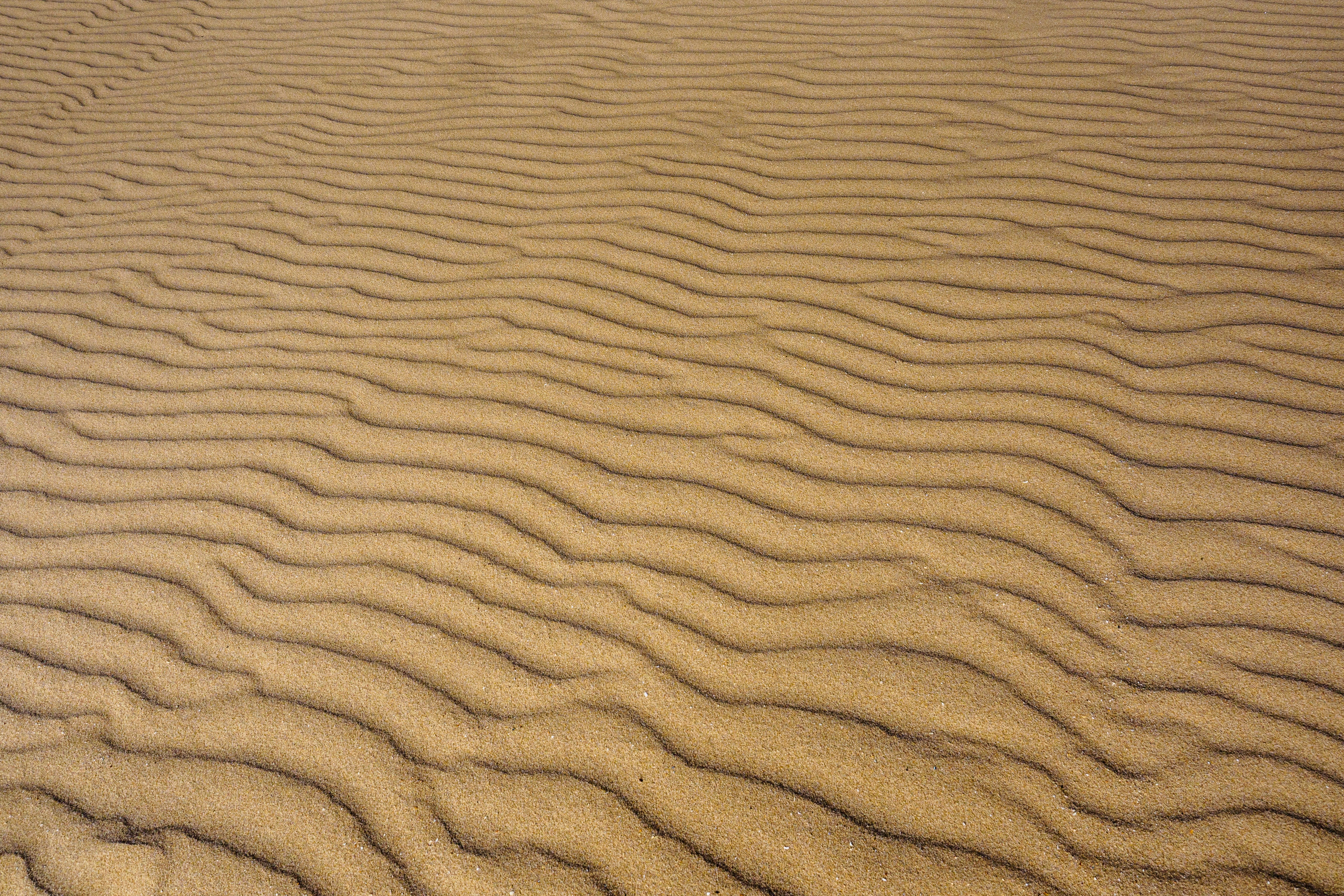 Скачать картинку Песок, Волны, Пустыня, Поверхность, Текстуры в телефон бесплатно.