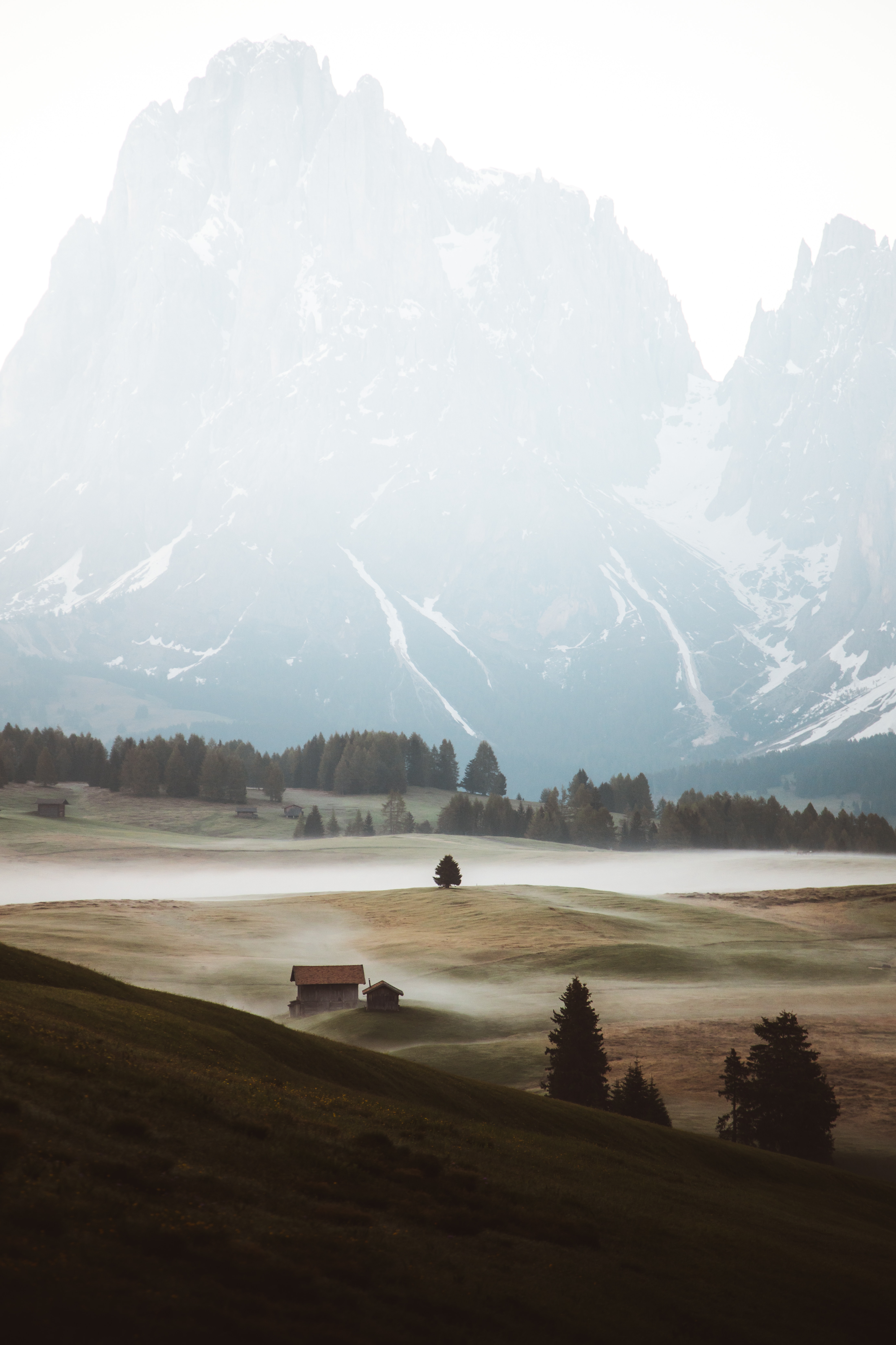 Download mobile wallpaper Building, Fog, Trees, Mountains, Nature, Hills for free.