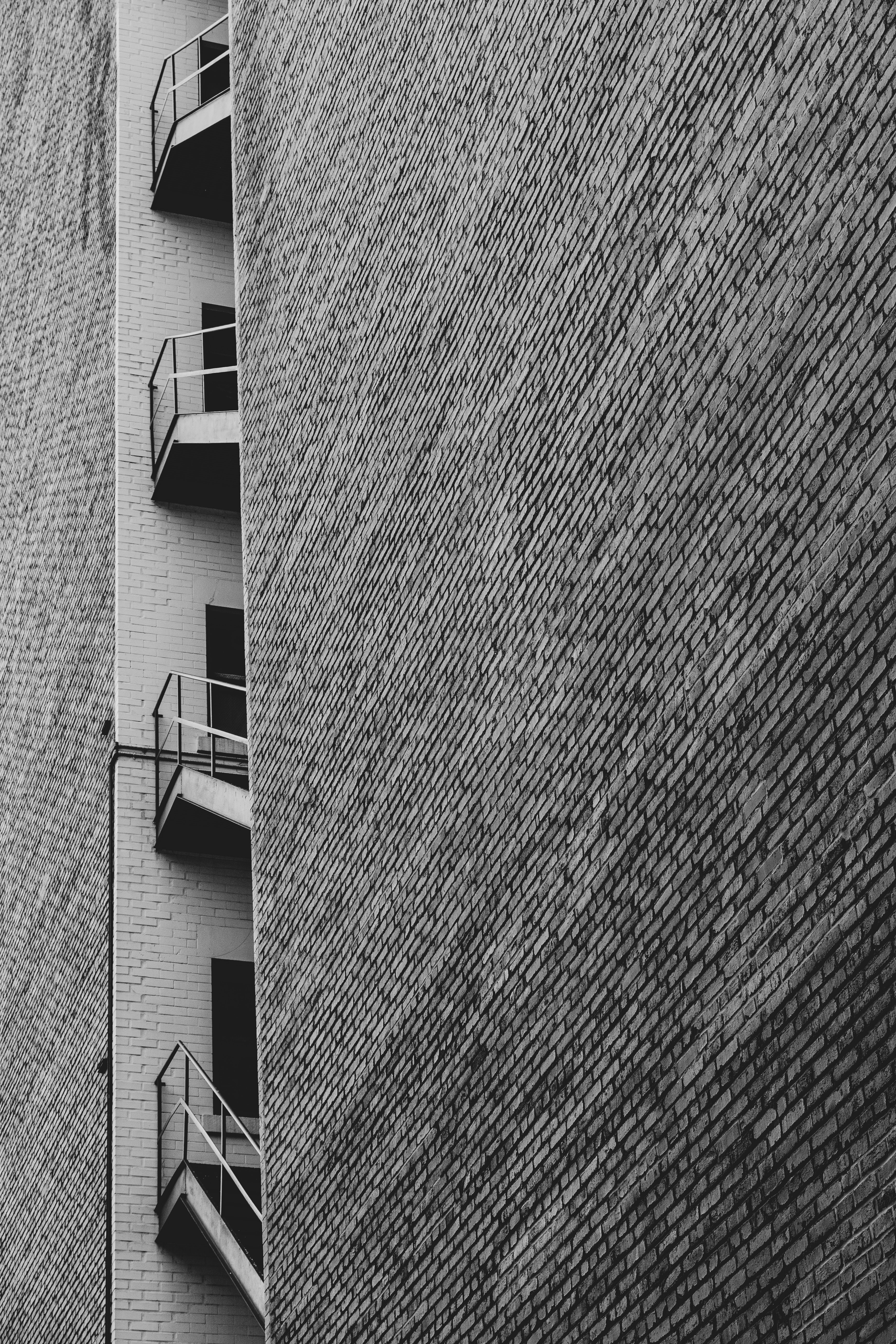 Download mobile wallpaper Facade, Building, Chb, Bw, Brick Wall, Dark for free.
