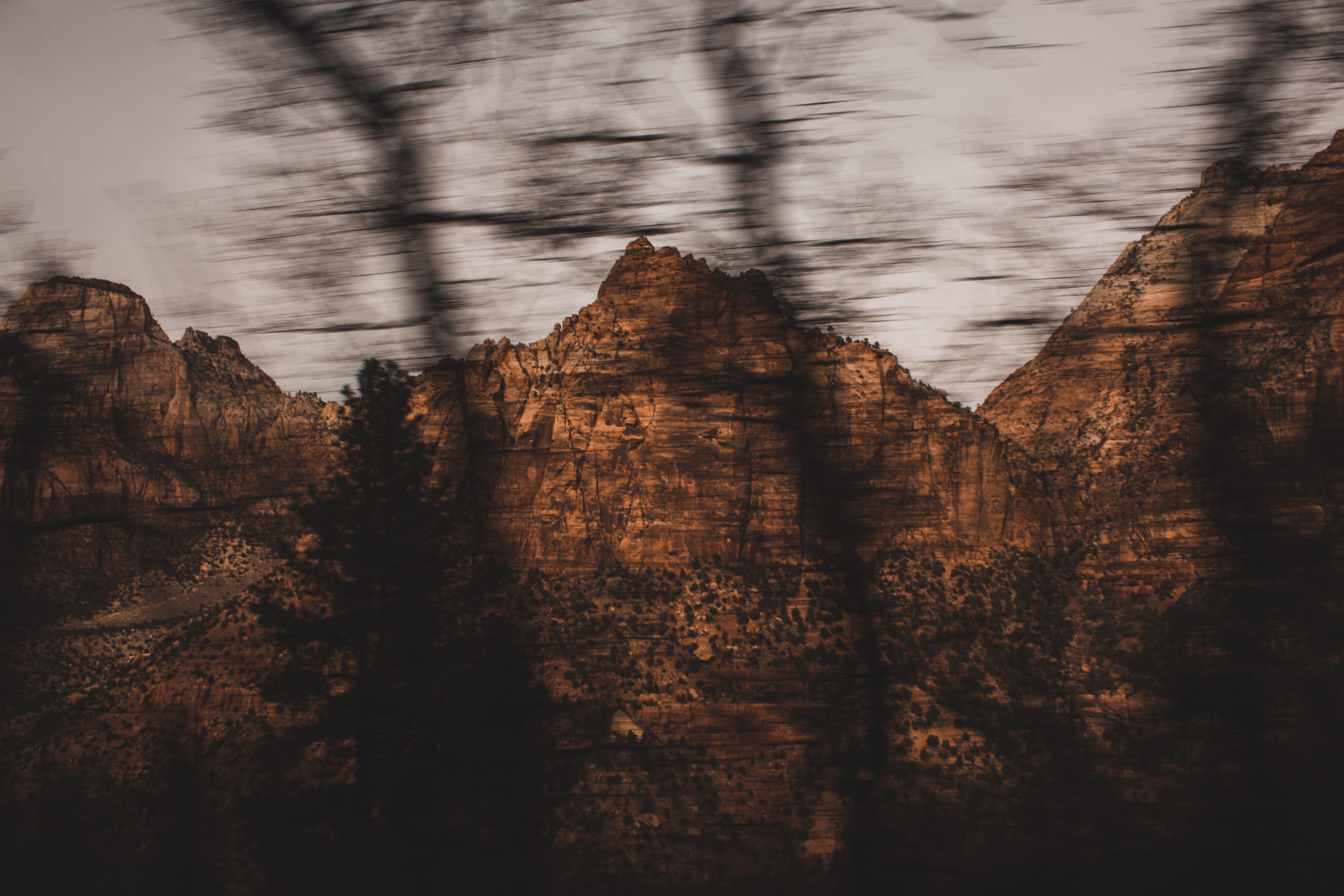 Download mobile wallpaper Rocks, Smooth, Trees, Mountains, Brown, Blur, Nature for free.