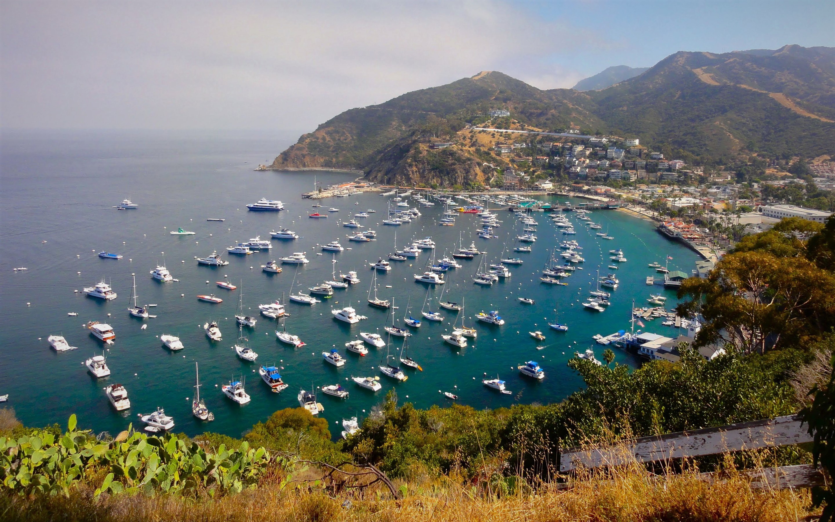 Download mobile wallpaper Sea, Mountain, Ocean, Boat, California, Harbor, Coastline, Town, Vehicles for free.