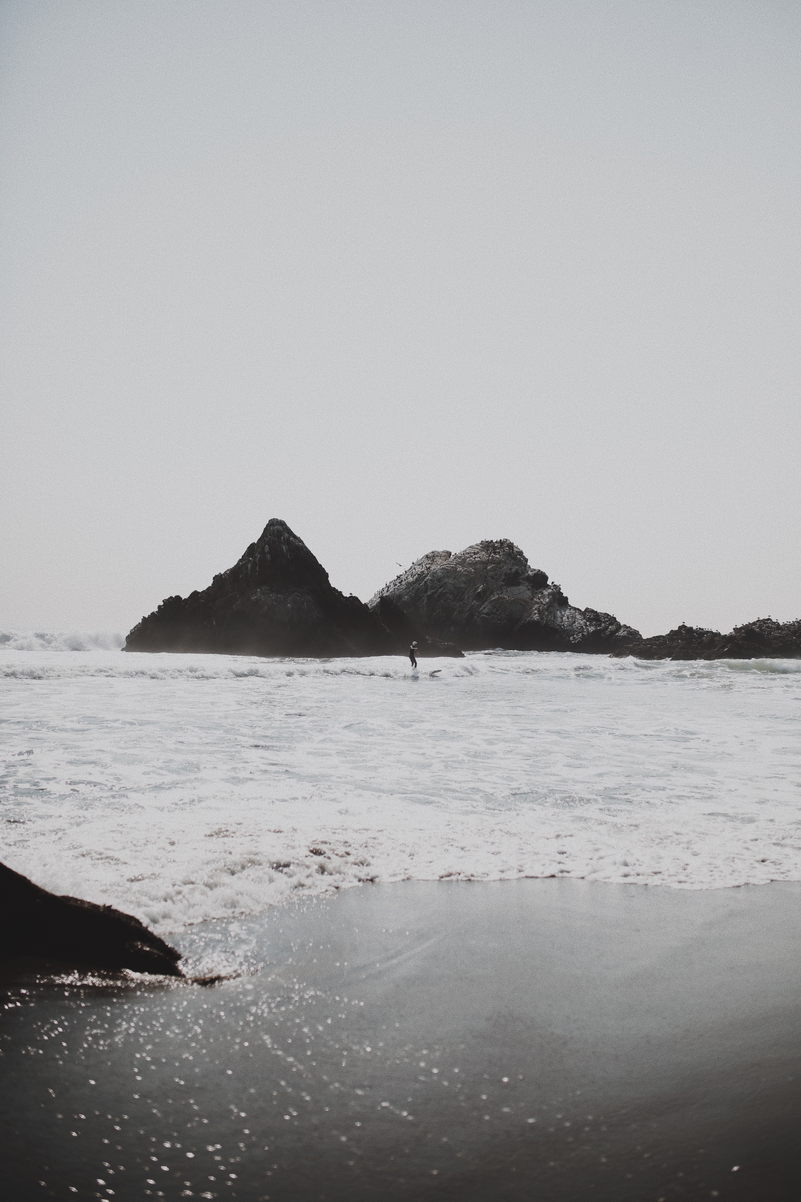Download mobile wallpaper Rocks, Waves, Surfer, Nature, Sea, Beach for free.