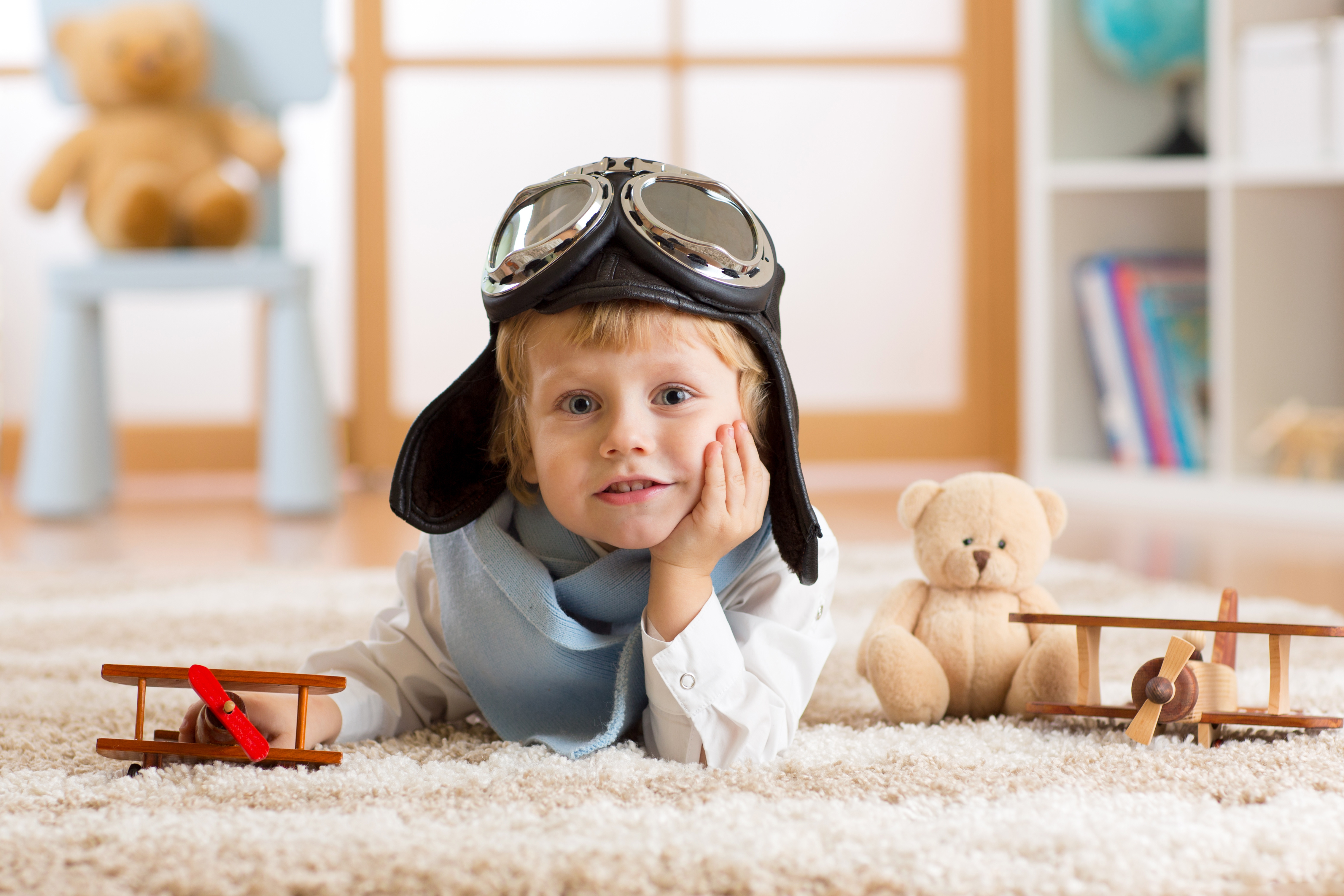 photography, child, aviator helmet, blue eyes, depth of field, little boy, teddy bear, toy