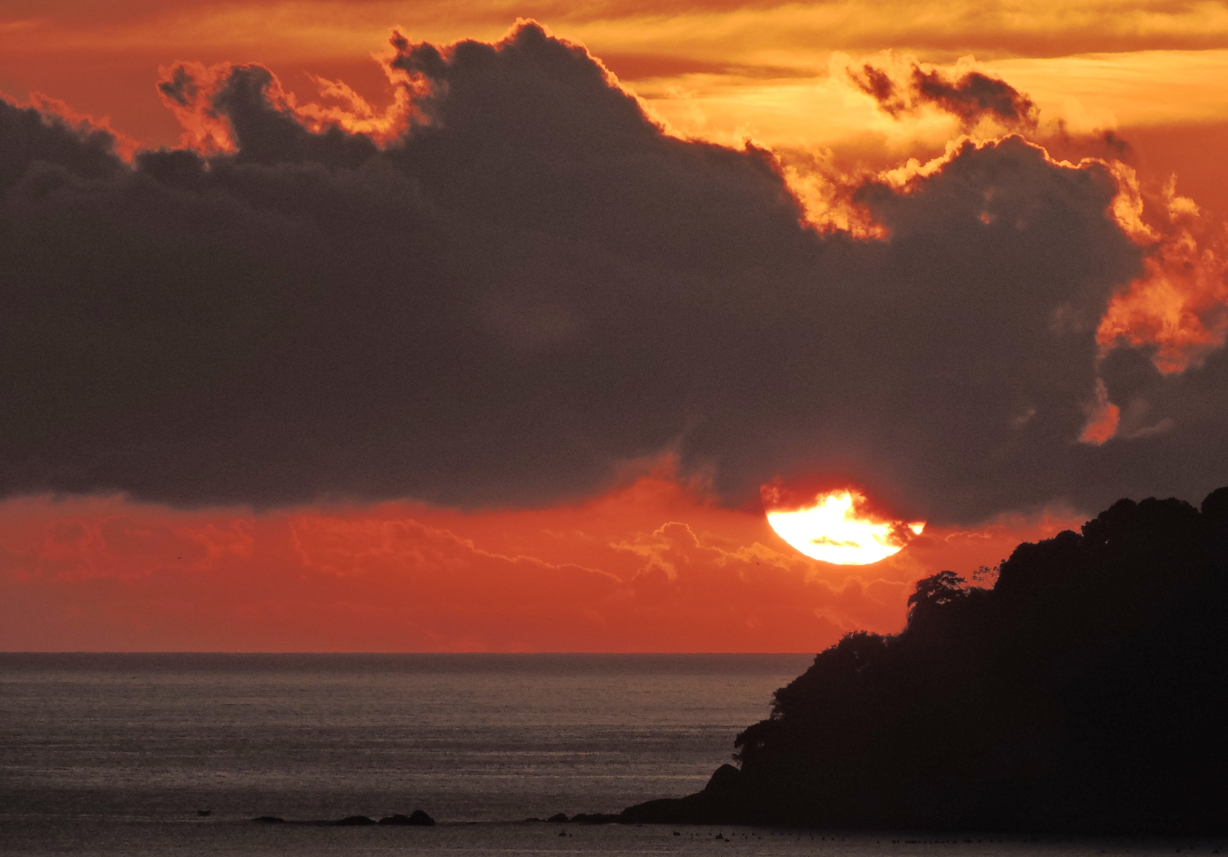 Download mobile wallpaper Sunset, Sky, Sea, Sun, Ocean, Earth, Cloud, Seashore for free.