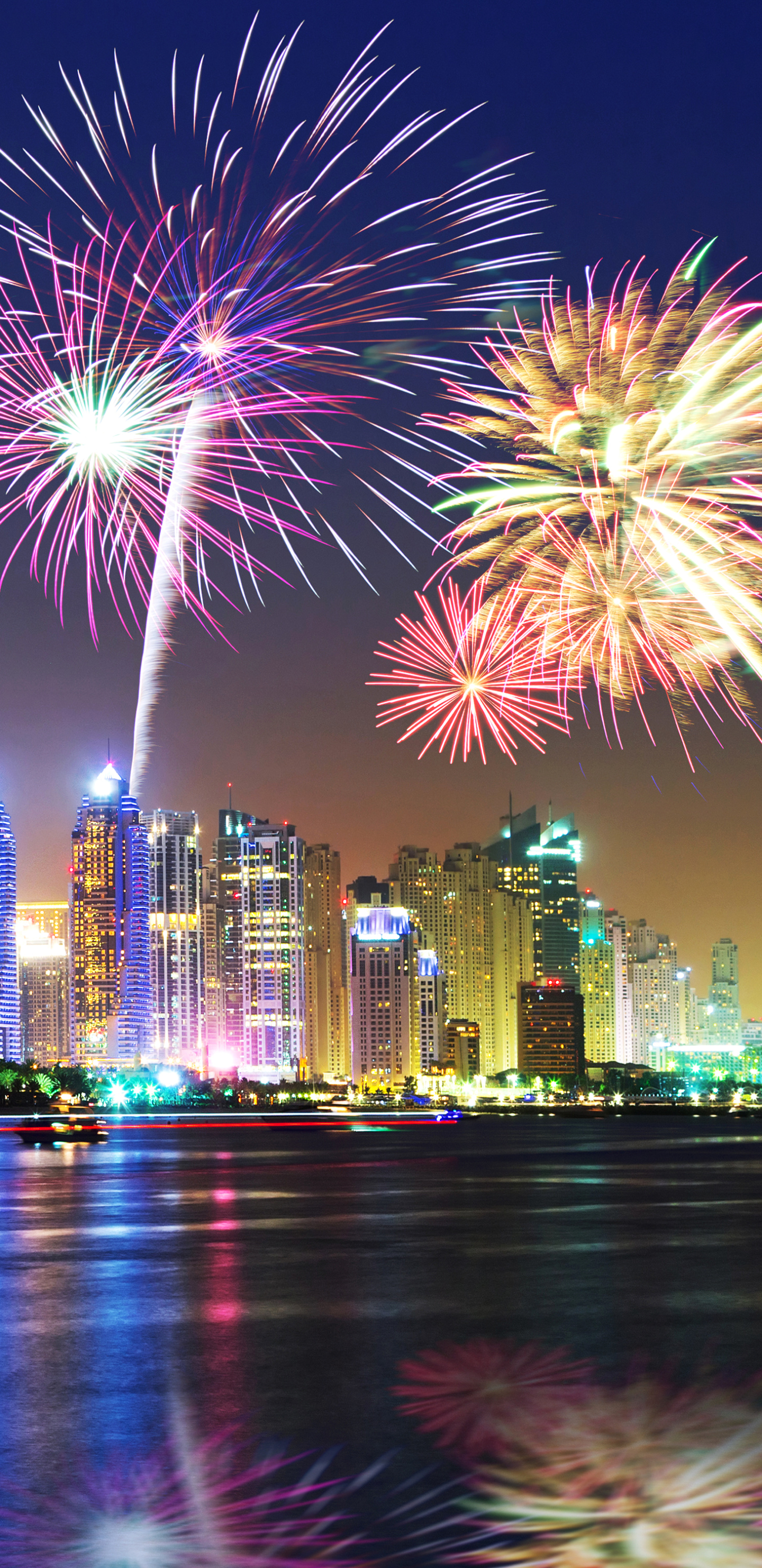 Download mobile wallpaper Night, Building, Dubai, Colorful, Cityscape, Fireworks, Photography for free.