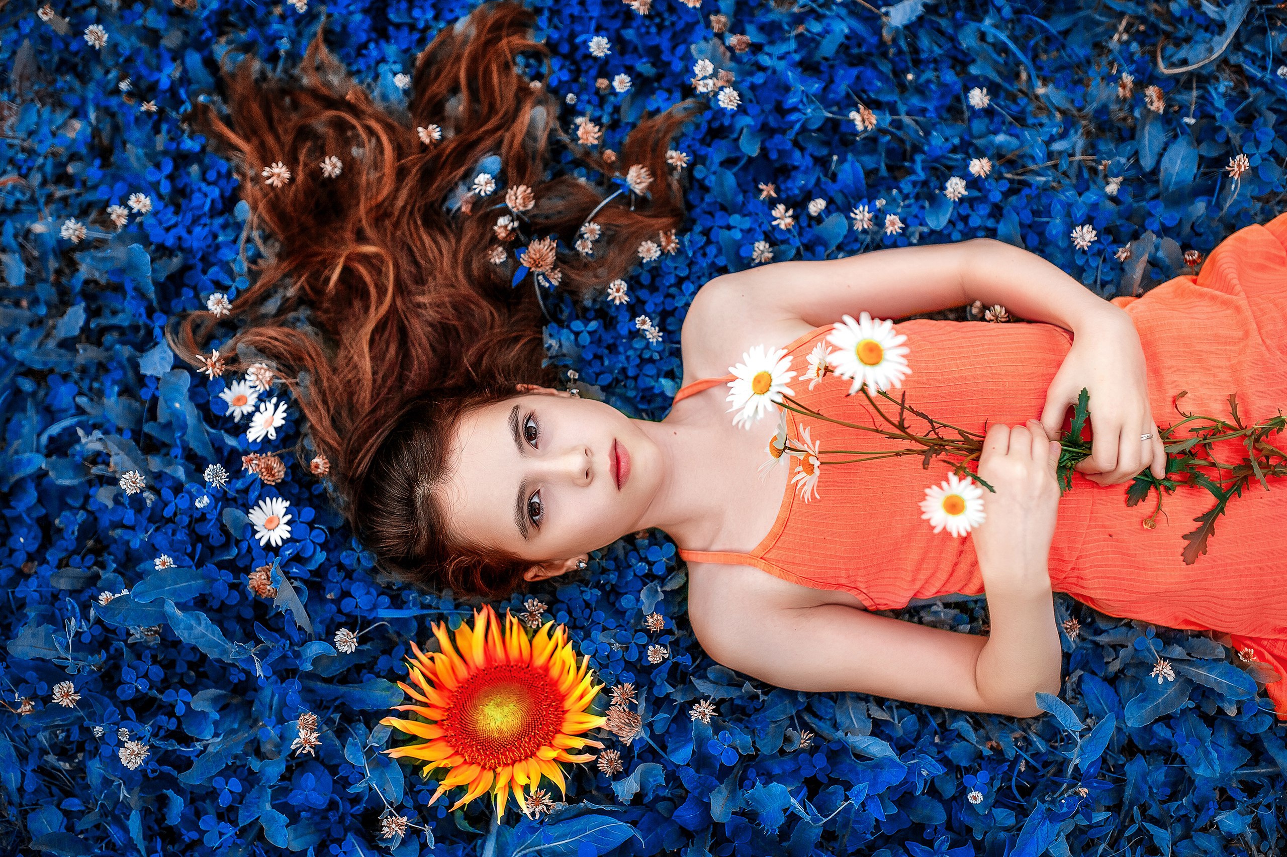 Free download wallpaper Flower, Redhead, Model, Women, Brown Eyes, Lying Down, Orange Dress on your PC desktop