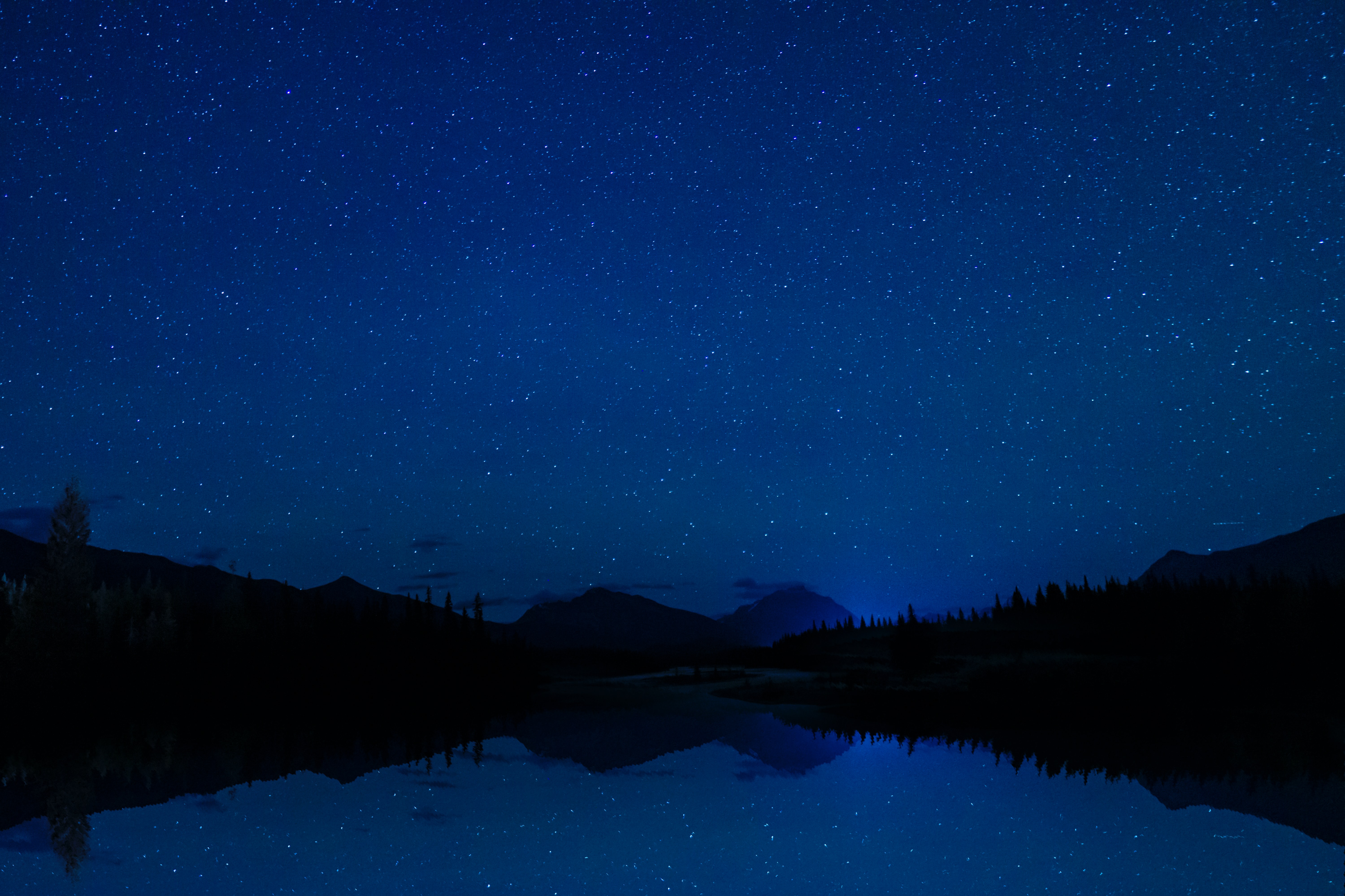 Download mobile wallpaper Reflection, Trees, Nature, Mountains, Starry Sky for free.