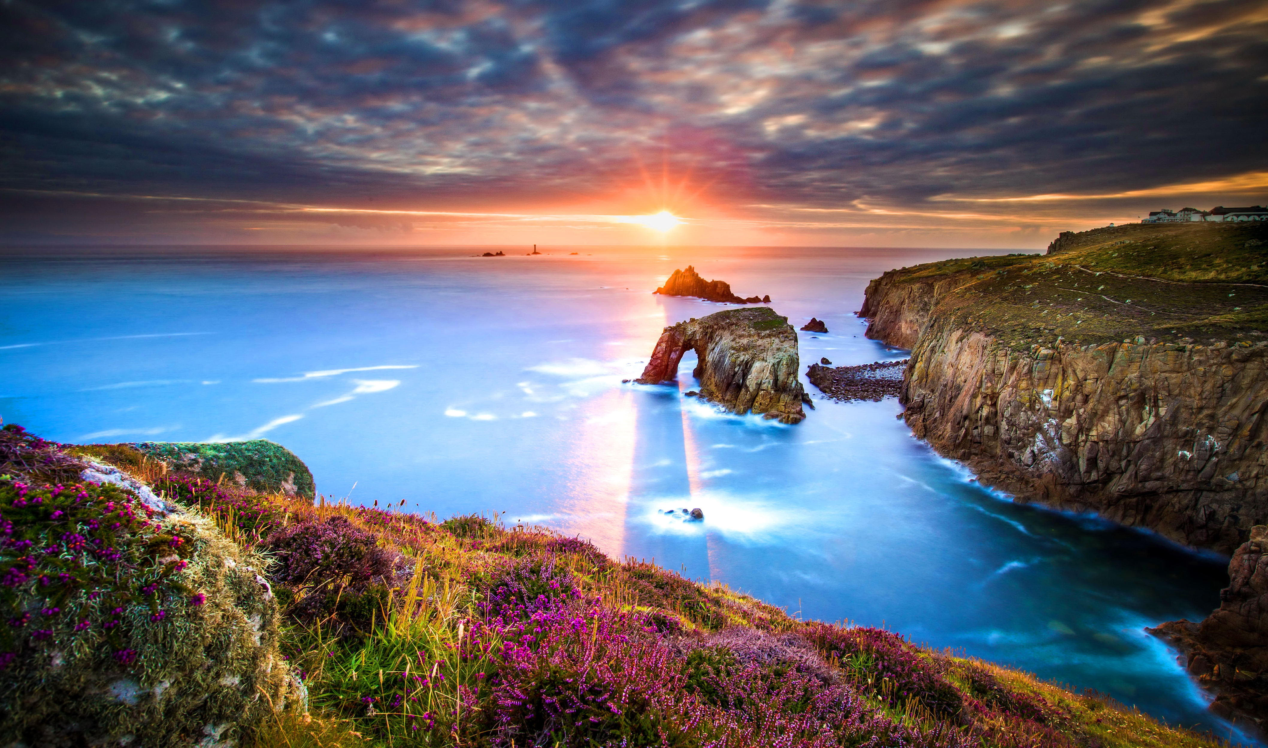 Download mobile wallpaper Sunset, Sea, Horizon, Flower, Ocean, Earth, Cliff, Coastline for free.