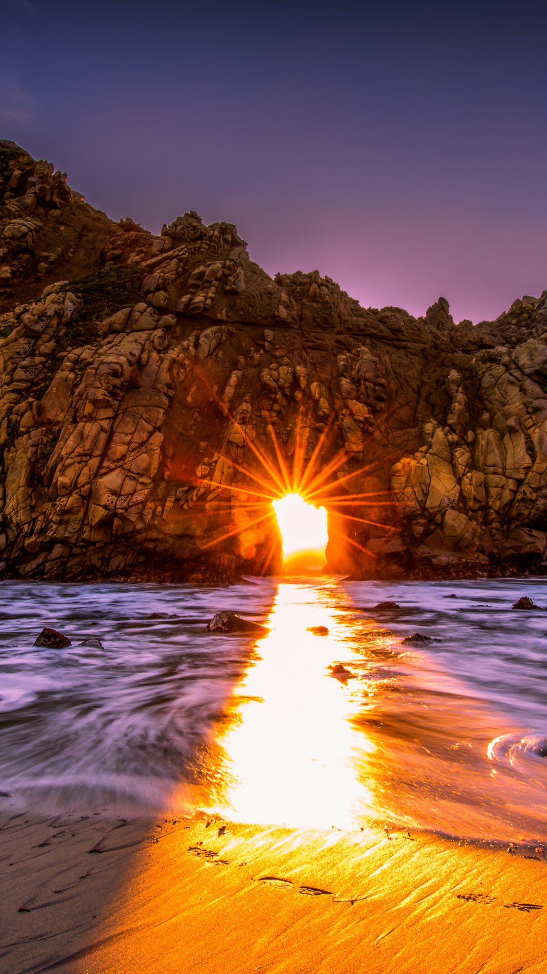 Download mobile wallpaper Sunset, Sea, Rock, Ocean, Earth, Arch, Sunbeam, Sunshine, Sunbean for free.