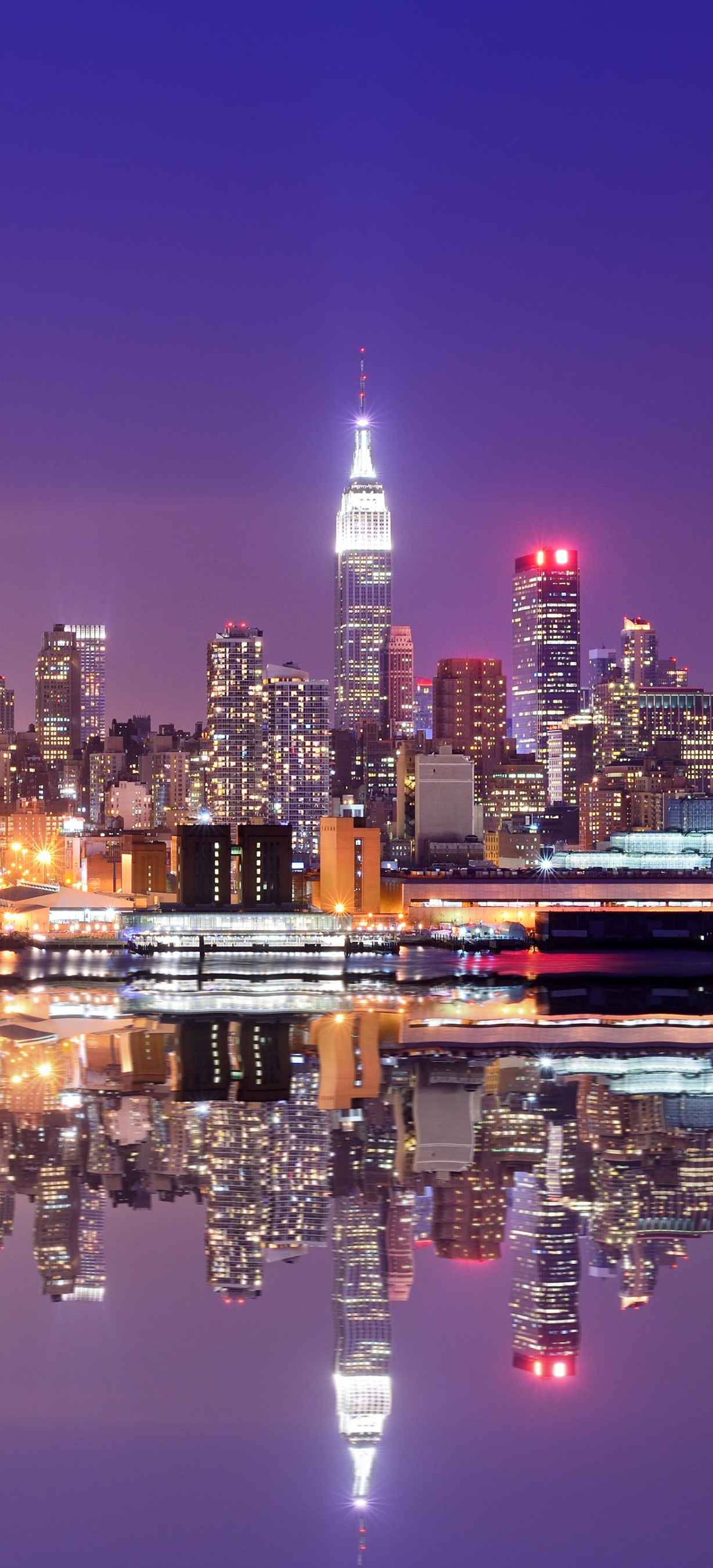 Download mobile wallpaper Cities, Night, Usa, City, Skyscraper, Building, Reflection, New York, Man Made for free.