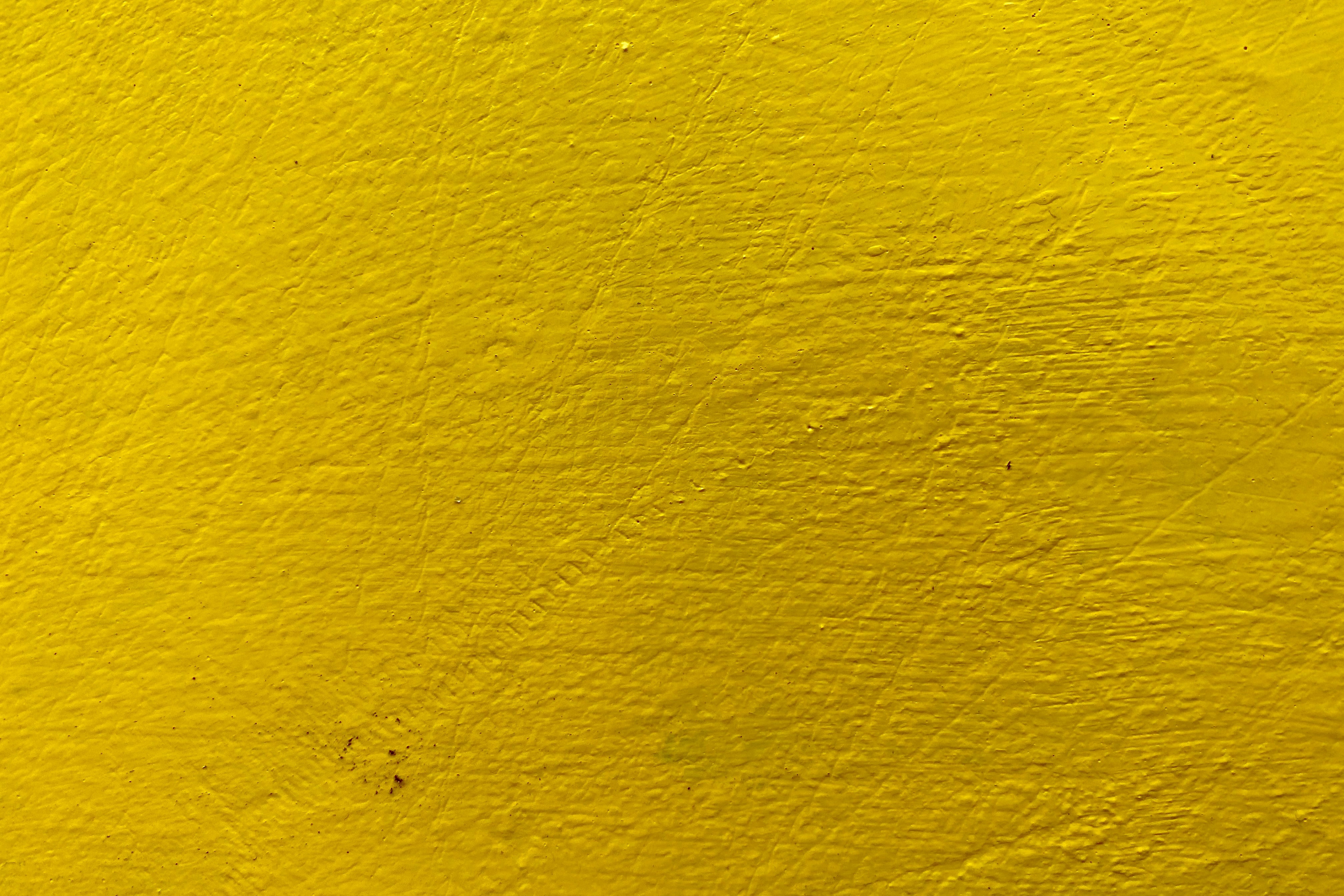 Скачать картинку Текстура, Краска, Стена, Жёлтый, Абстрактные в телефон бесплатно.