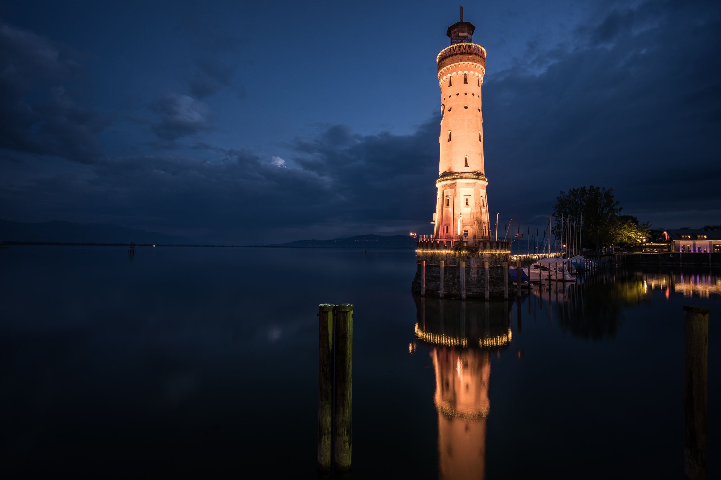 Free download wallpaper Night, Building, Reflection, Lighthouse, Man Made on your PC desktop