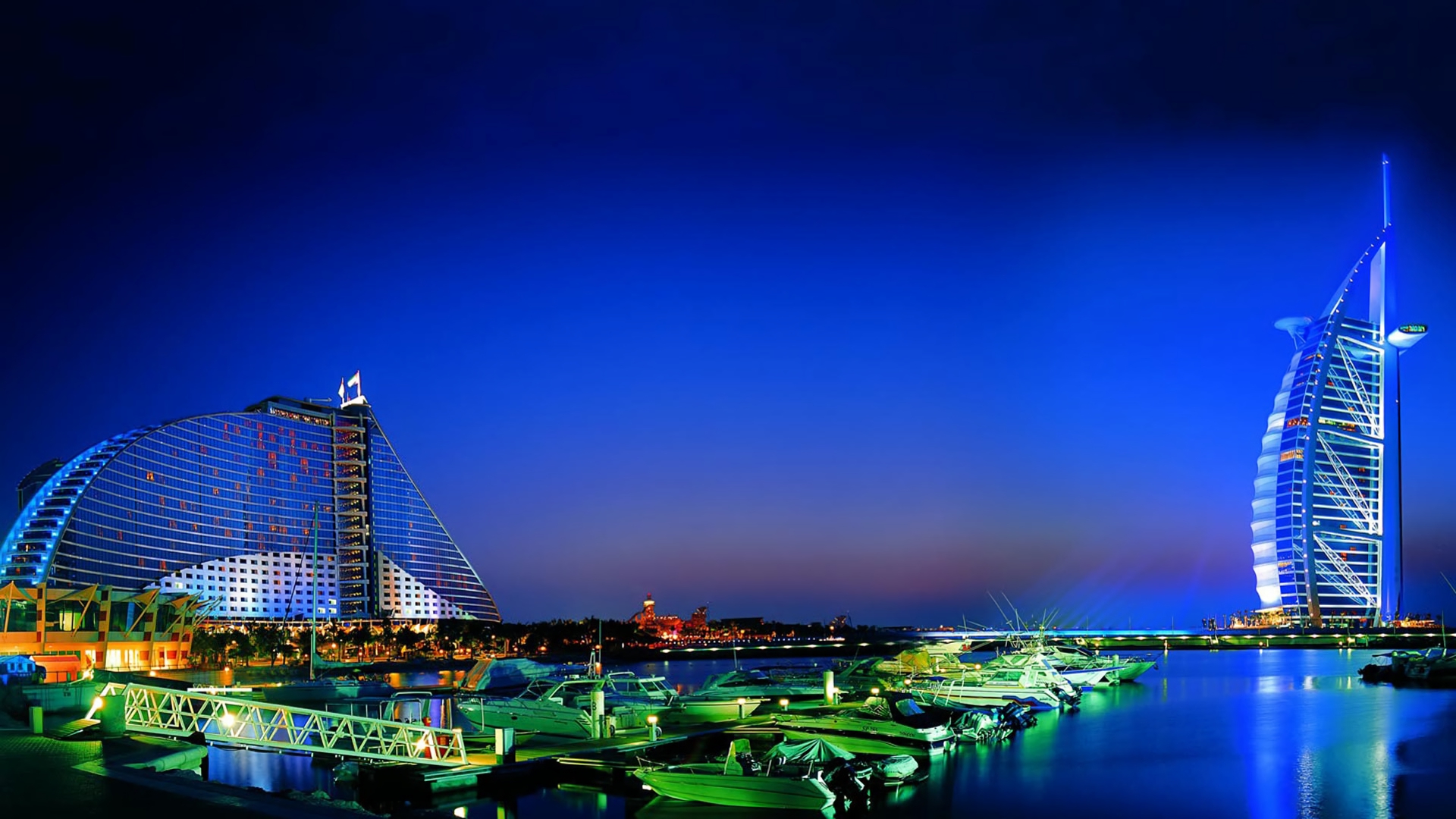 Download mobile wallpaper Night, City, Building, Dubai, Boat, Harbor, Man Made for free.