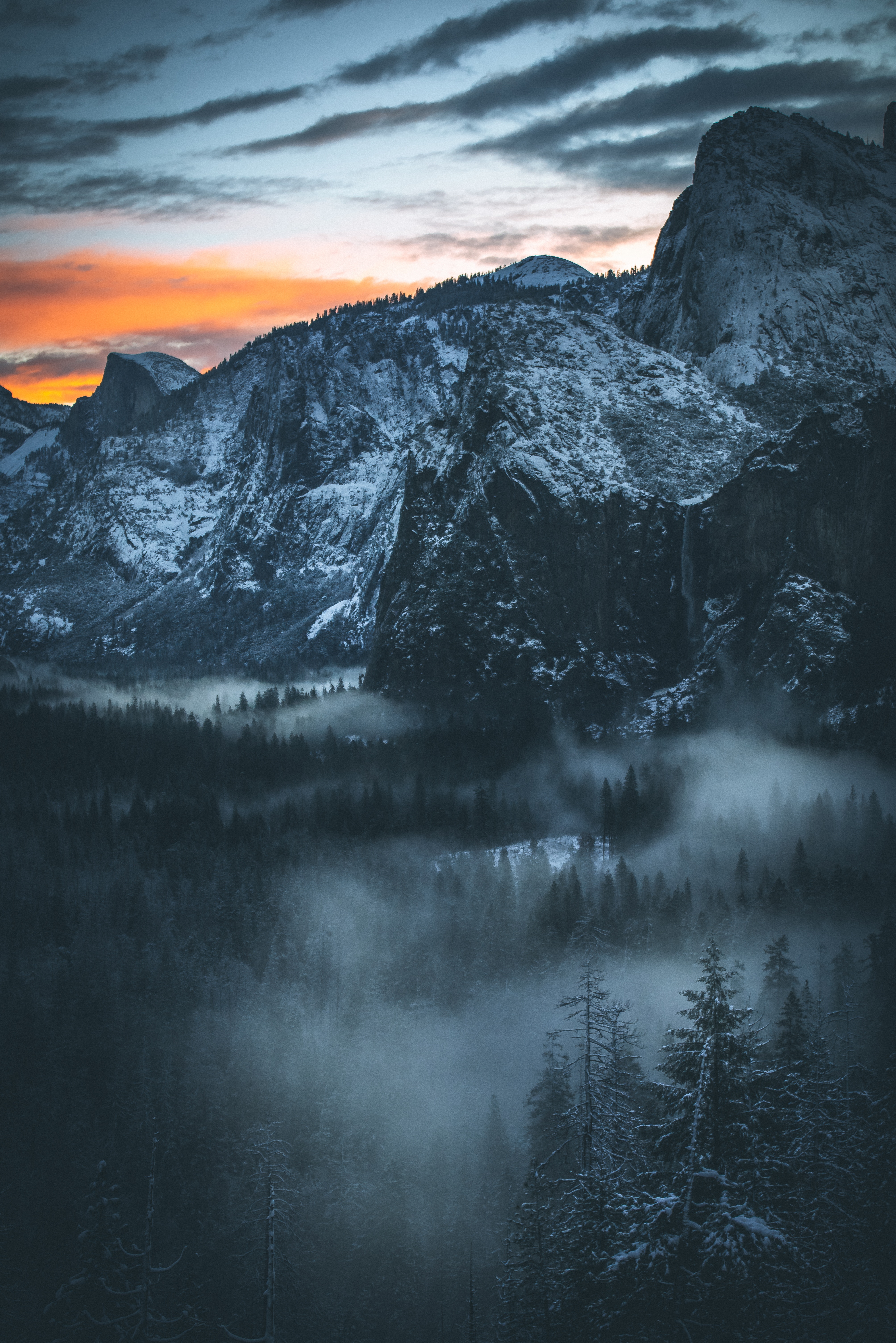Download mobile wallpaper Fog, Snowbound, Snow Covered, Nature, Snow, Sky, Sunset, Mountains for free.