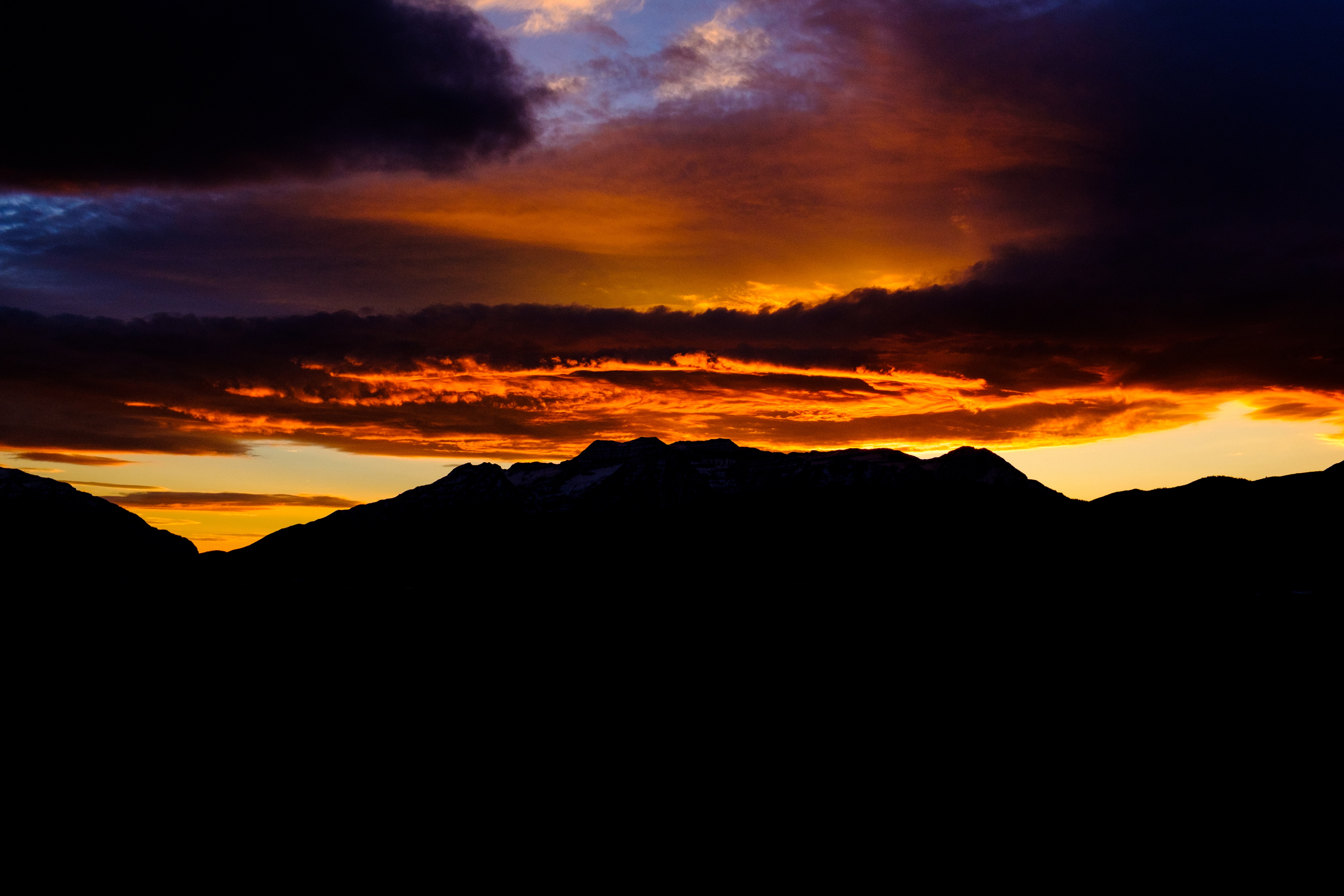 Download mobile wallpaper Clouds, Sky, Mountains, Sunset, Dark for free.