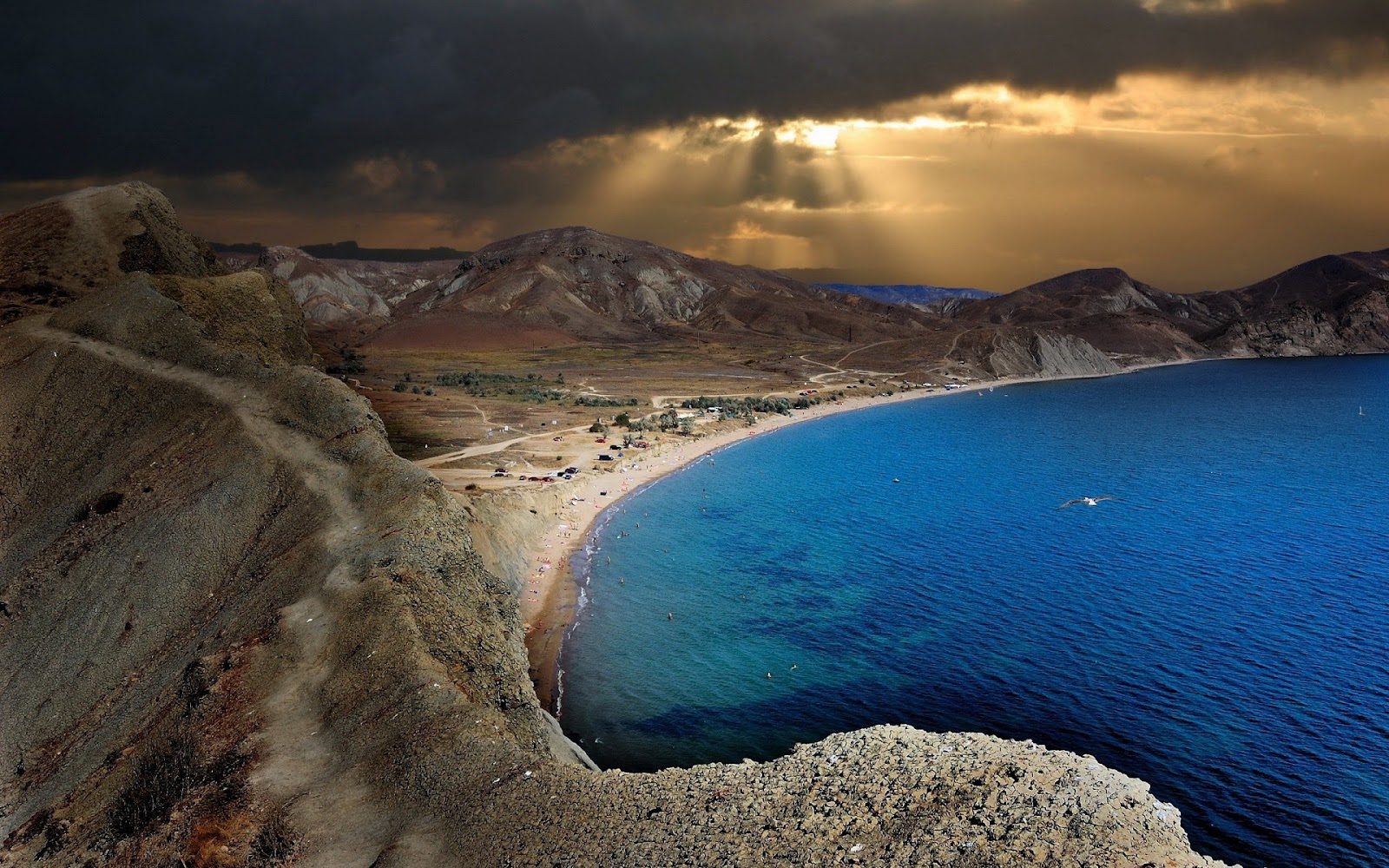Free download wallpaper Landscape, Sunset, Sea, Desert, Mountain, Ocean, Earth, Cloud, Coastline, Sunbeam on your PC desktop