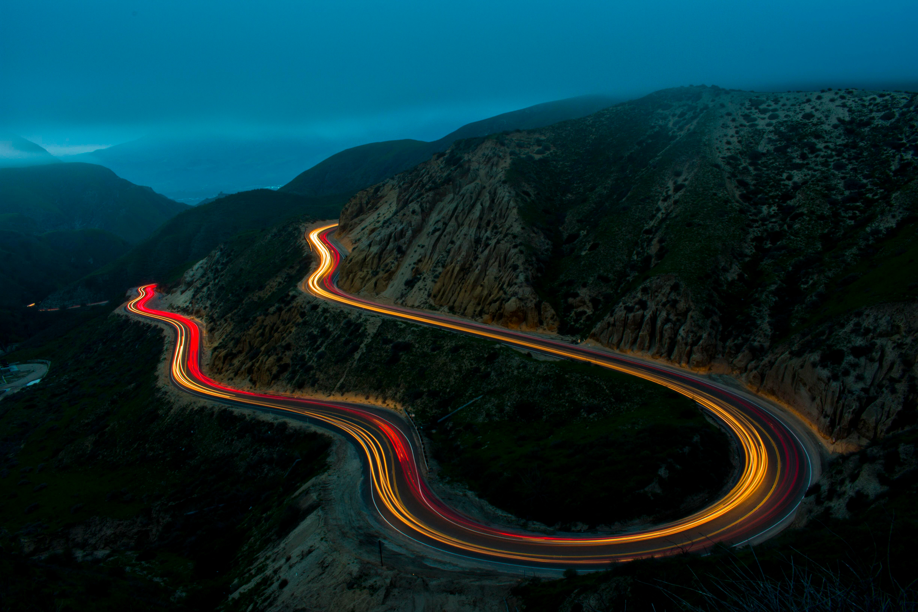 Download mobile wallpaper Night, Mountain, Light, Road, Man Made, Time Lapse for free.