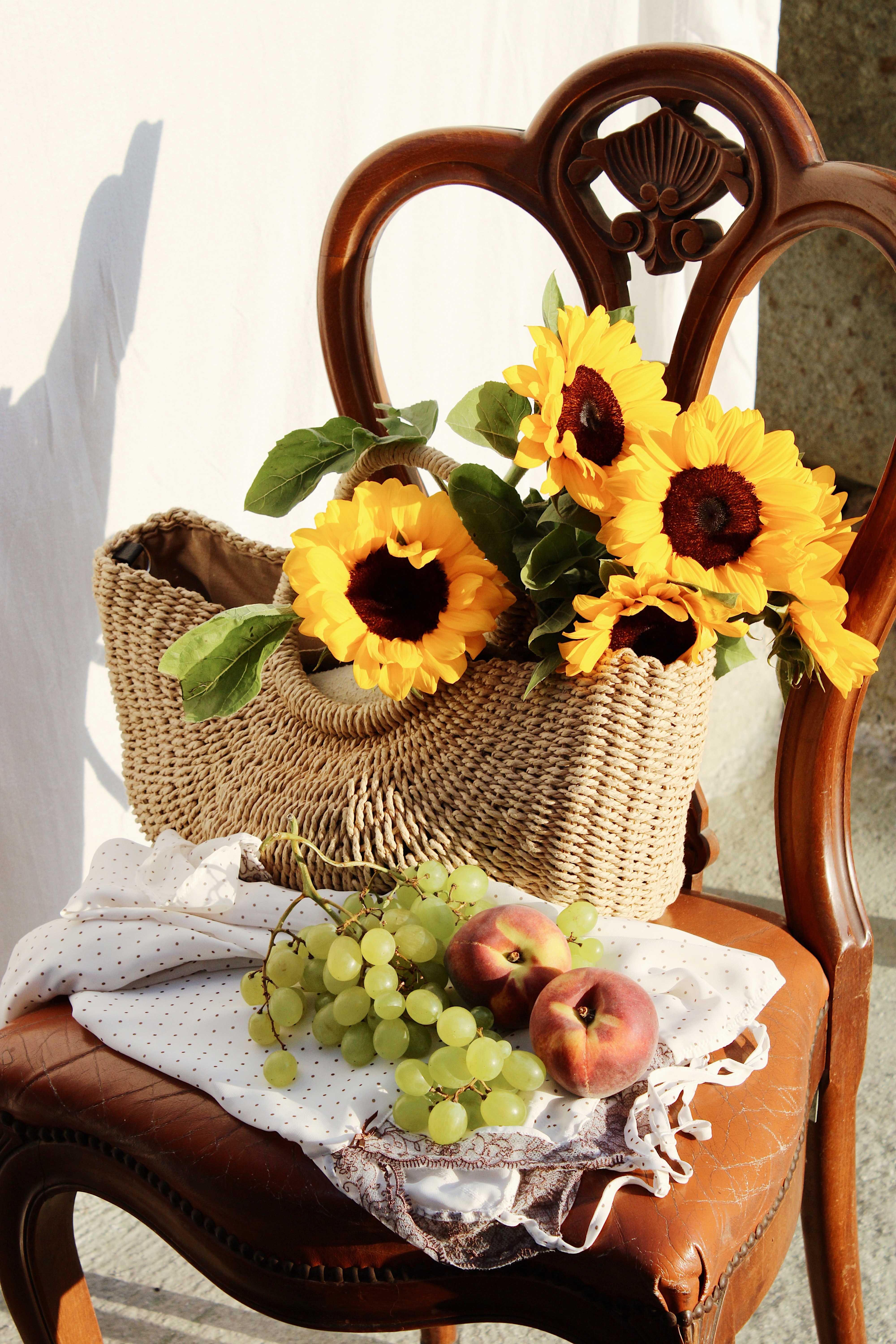 Free download wallpaper Flowers, Miscellanea, Chair, Basket, Miscellaneous, Peach, Grapes, Sunflowers on your PC desktop