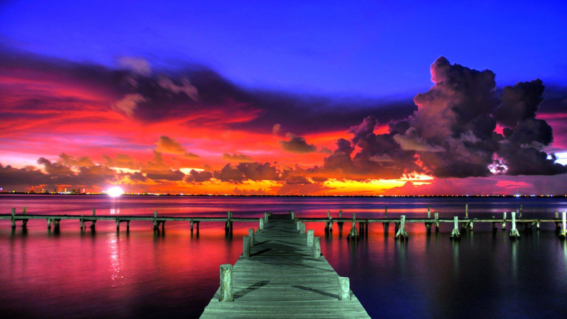 Download mobile wallpaper Sunset, Sky, Sea, Horizon, Pier, Ocean, Man Made, Orange (Color) for free.