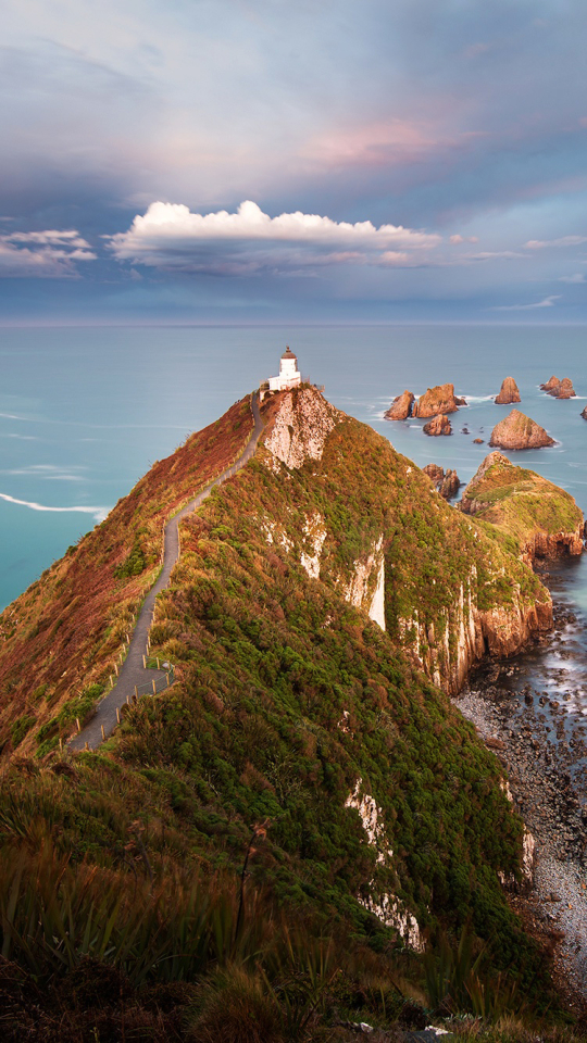 Download mobile wallpaper Horizon, Road, Ocean, Lighthouse, Man Made for free.